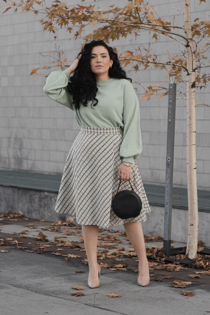 Green knit sweater with patterned skirt