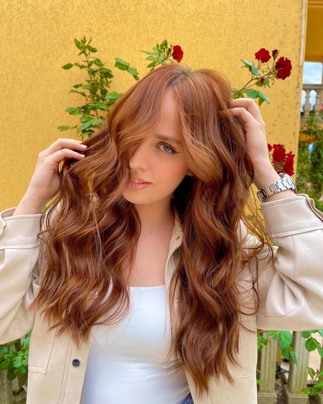 Copper Hair Summer Ideas 2026: Beach Chic Outfit Girl with beautiful light copper hair, wearing a white crochet crop top and high-waisted denim shorts, smiling at a summer beach. Perfect copper hair summer ideas 2026.
