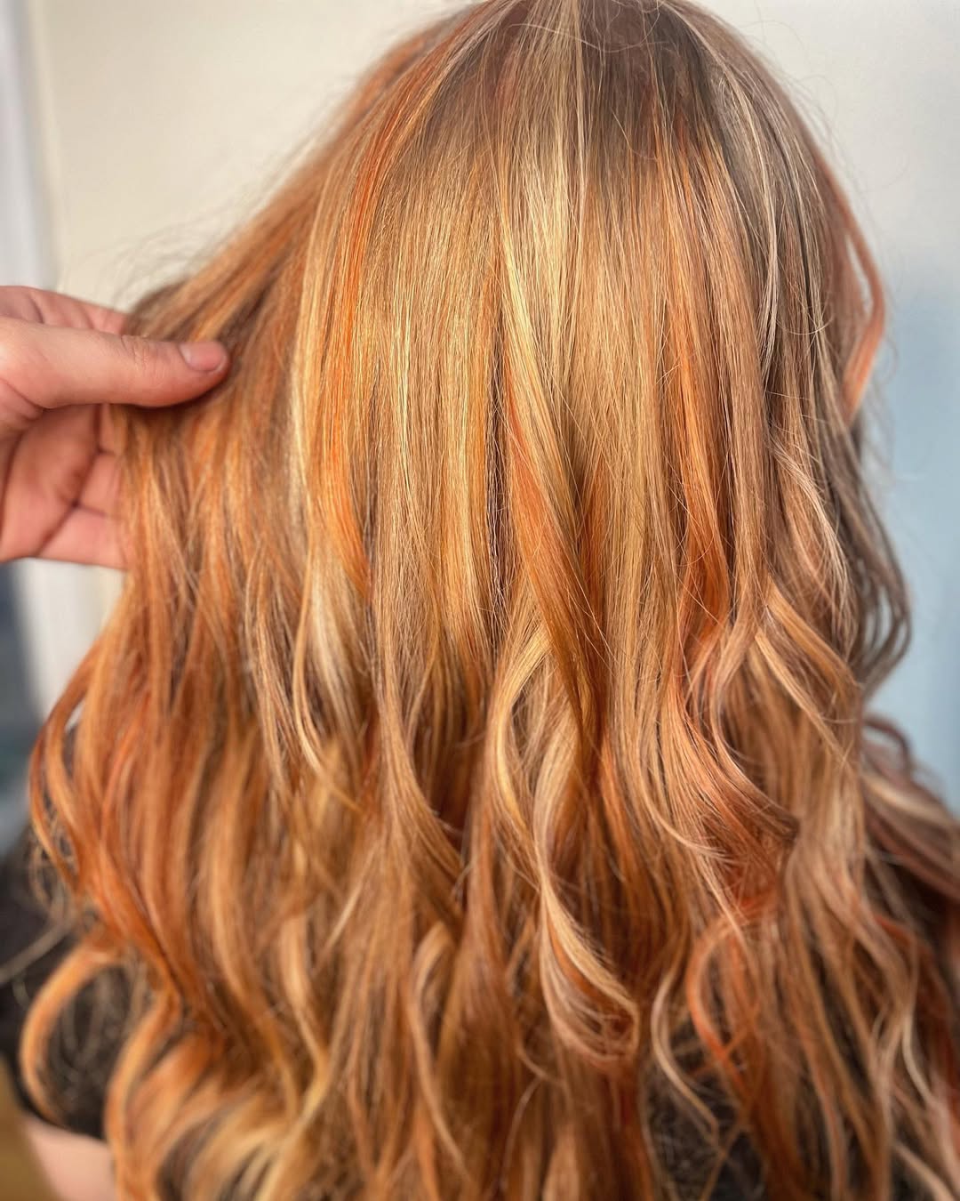 Stunning Copper Hair Summer Ideas 2026: Casual Chic Look Woman with vibrant copper hair smiling outdoors, wearing a white crochet top, denim shorts, and sunglasses, perfect for copper hair summer ideas 2026.