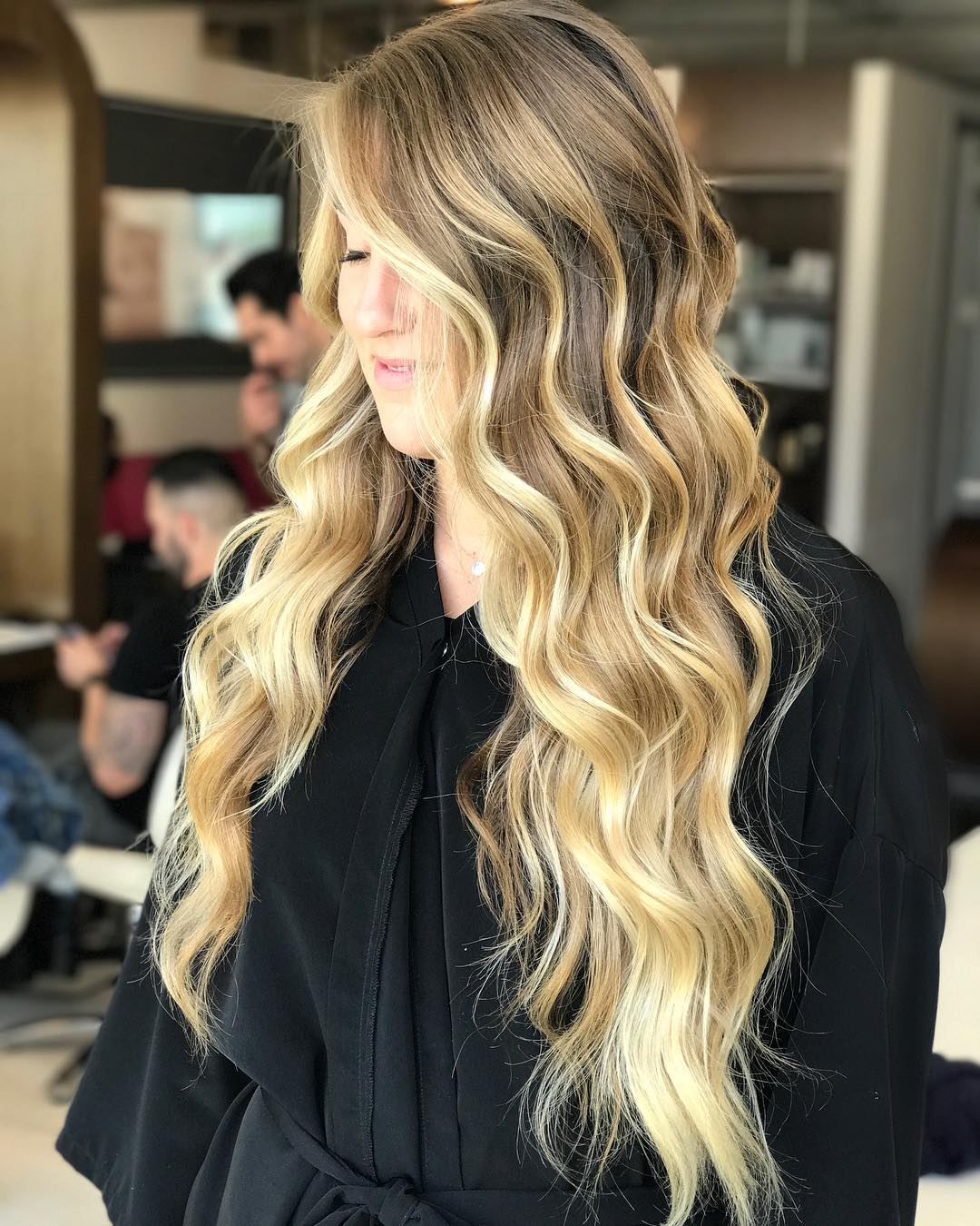 Effortless Long Hair Summer Hairstyles 2026 Woman with long flowing blonde hair styled in loose waves, enjoying a sunny summer day. Perfect long hair summer hairstyles 2026 inspiration for effortless chic.