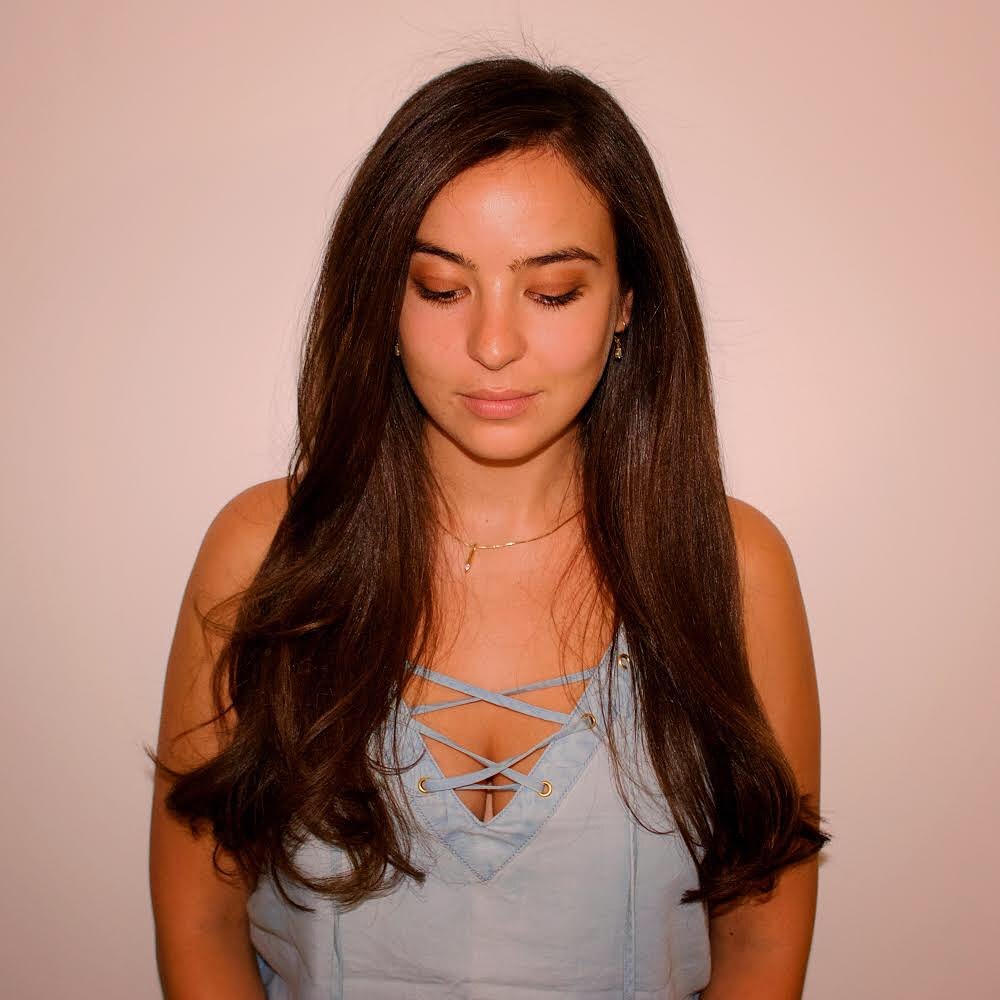 Effortless Updo: Long Hair Summer Hairstyle 2026 A woman with beautiful long hair styled in a chic, breezy updo perfect for long hair summer hairstyles 2026. The look is elegant yet casual.