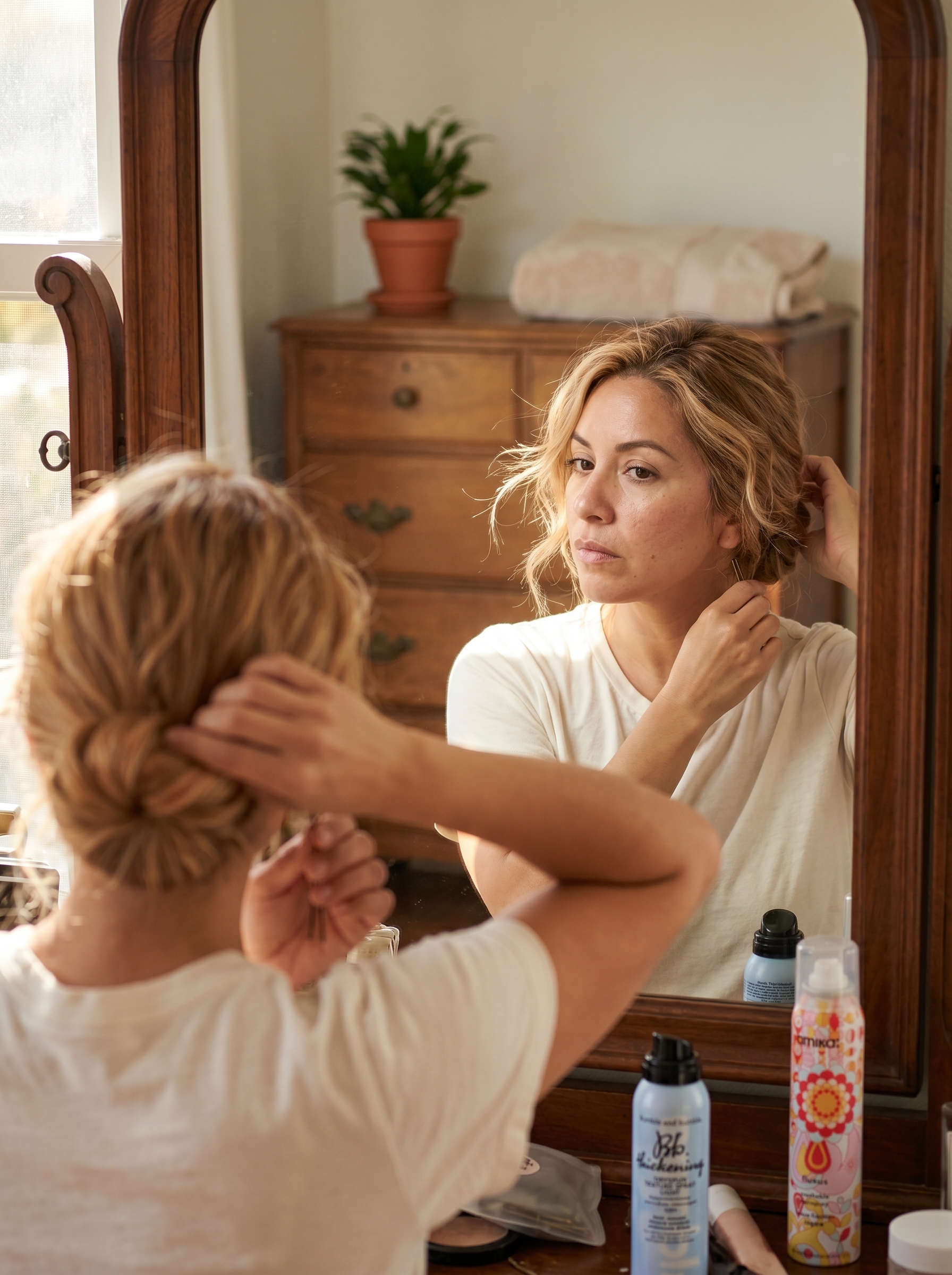 Ethereal Low Bun: Long Hair Summer Hairstyles 2026 A romantic and ethereal Airy Gossamer Low Bun, showcasing linen blonde and nectarine blonde long hair, an ideal soft style for long hair summer hairstyles 2026. Perfect for a date night or everyday elegance, using a lightweight texturizing spray.