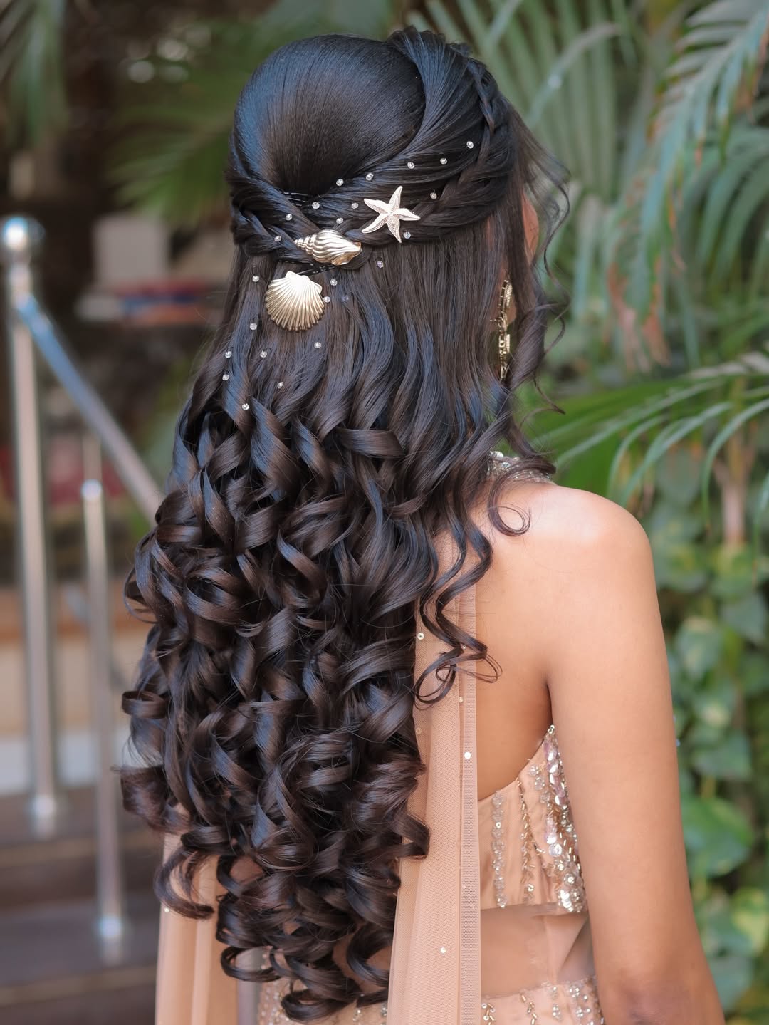 Effortless High Bun: Simple Summer Hairstyles 2026 Close-up of a woman with long, sun-kissed hair in a messy high bun, perfect for simple summer hairstyles 2026.
