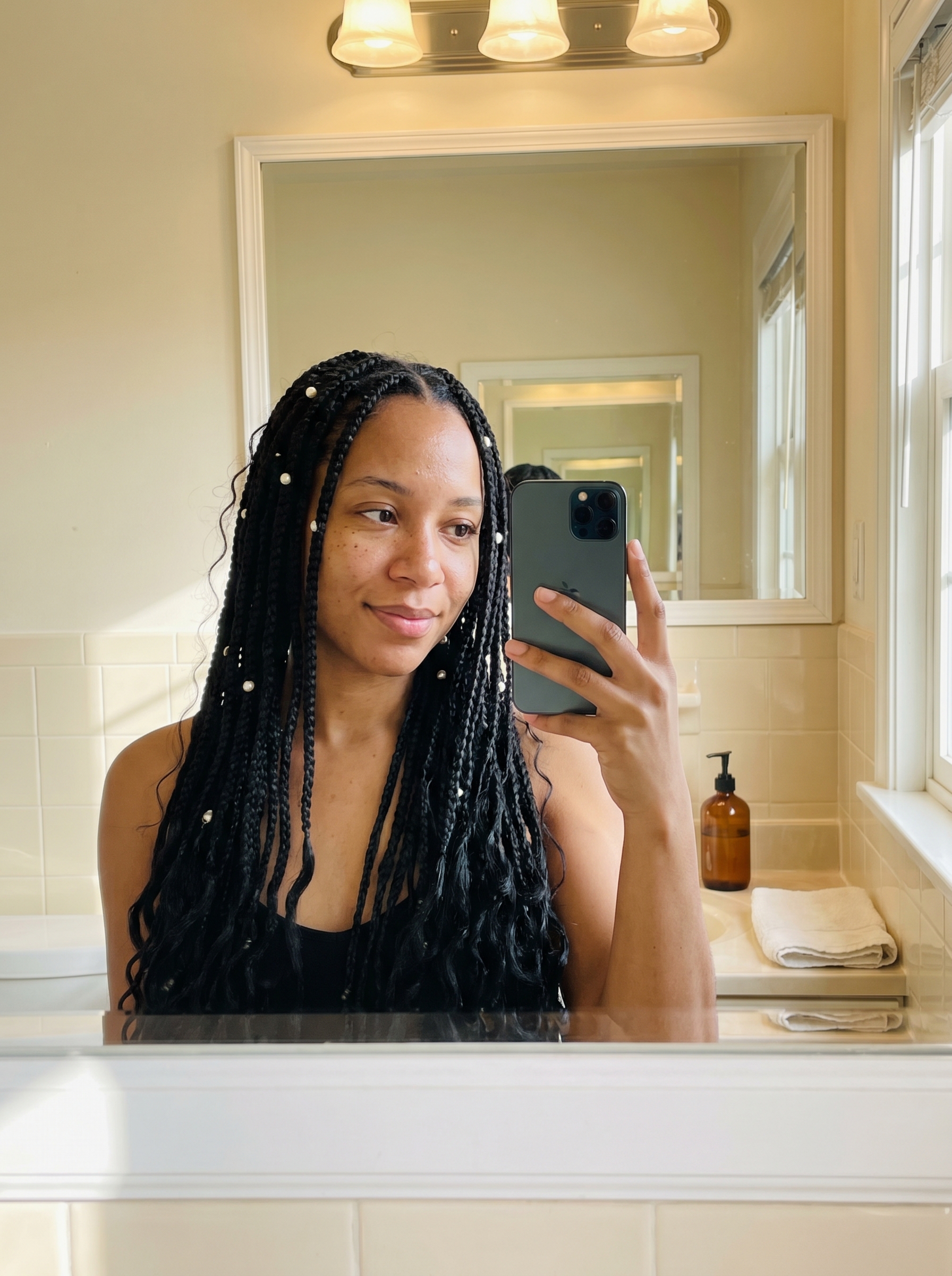 Glamorous hydro-glossed mermaid braids with pearl accents, an elegant summer braid hairstyle 2026. Features sun-bleached buttercream. Ideal for resorts or festivals.