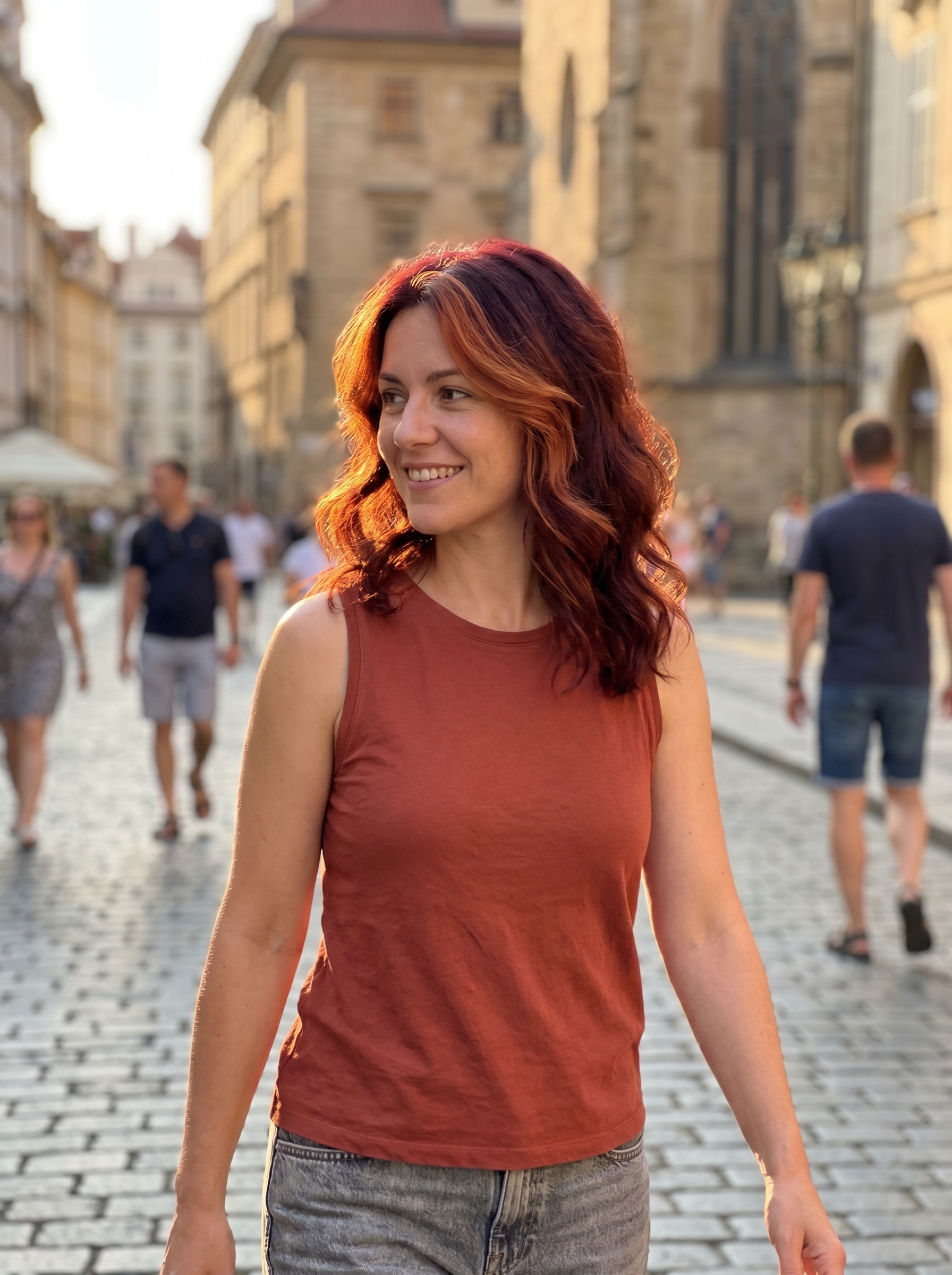 Rich mahogany hair with vibrant auburn face-framing highlights, illustrating a 'Mahogany Melt with Face Frame' as a stunning option for summer dark hair looks 2026. This warm, eye-catching color features chocolate cherry tones.