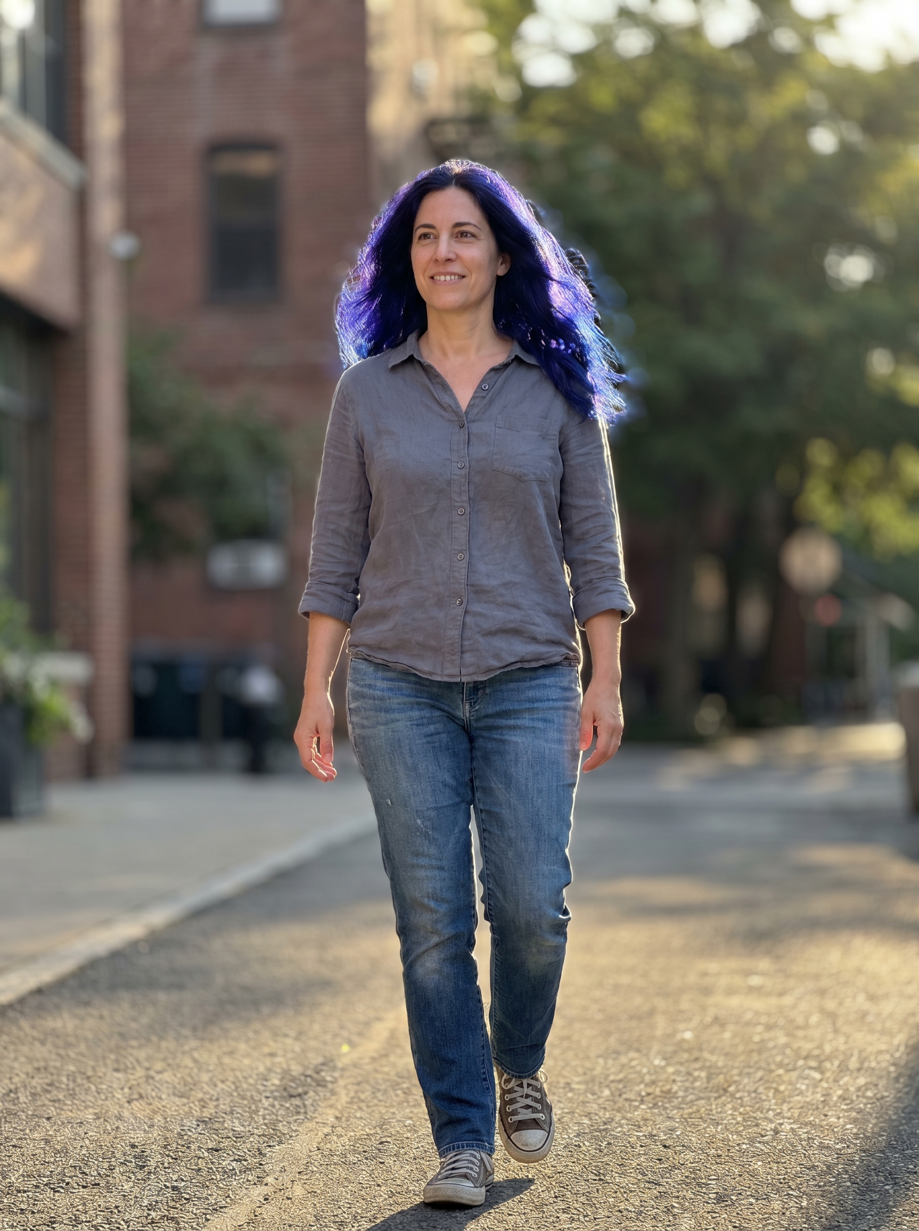 Sleek, dark brunette hair deeply conditioned with a 'Midnight Brunette with Blueberry Gloss', revealing cool indigo and ink tones, a sophisticated summer dark hair look for 2026. This dramatic color is perfect for special events.