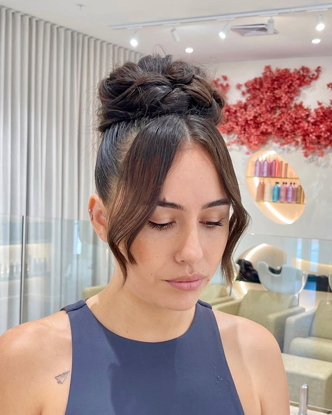 Elegant Braided Half-Updo: Summer Hairstyle Ideas 2026 Blonde woman with a braided half-updo featuring delicate pearl accents, perfect for elegant summer hairstyle ideas 2026. This romantic look is ideal for weddings or elevated casual attire.