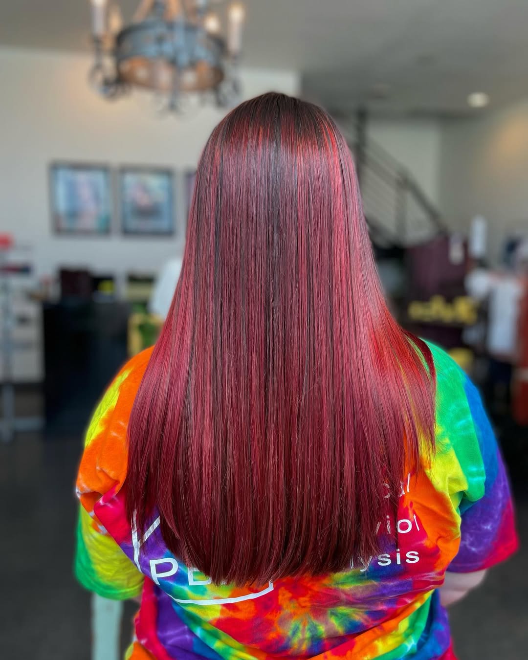 Stunning Summer Red Hair Looks 2026: Floral Sundress Vibes Beautiful woman with vibrant red hair, styled in soft waves, wearing a floral sundress outdoors for summer red hair looks. Her makeup is natural, highlighting freckles.