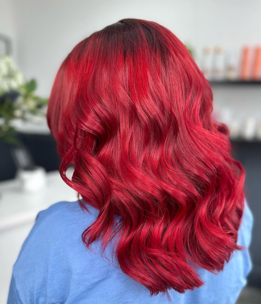 Stunning Summer Red Hair Looks 2026: Effortless Sundress Style A woman with vibrant summer red hair posing outdoors, wearing a flowy white sundress and sunglasses, embracing natural beauty for summer red hair looks 2026.