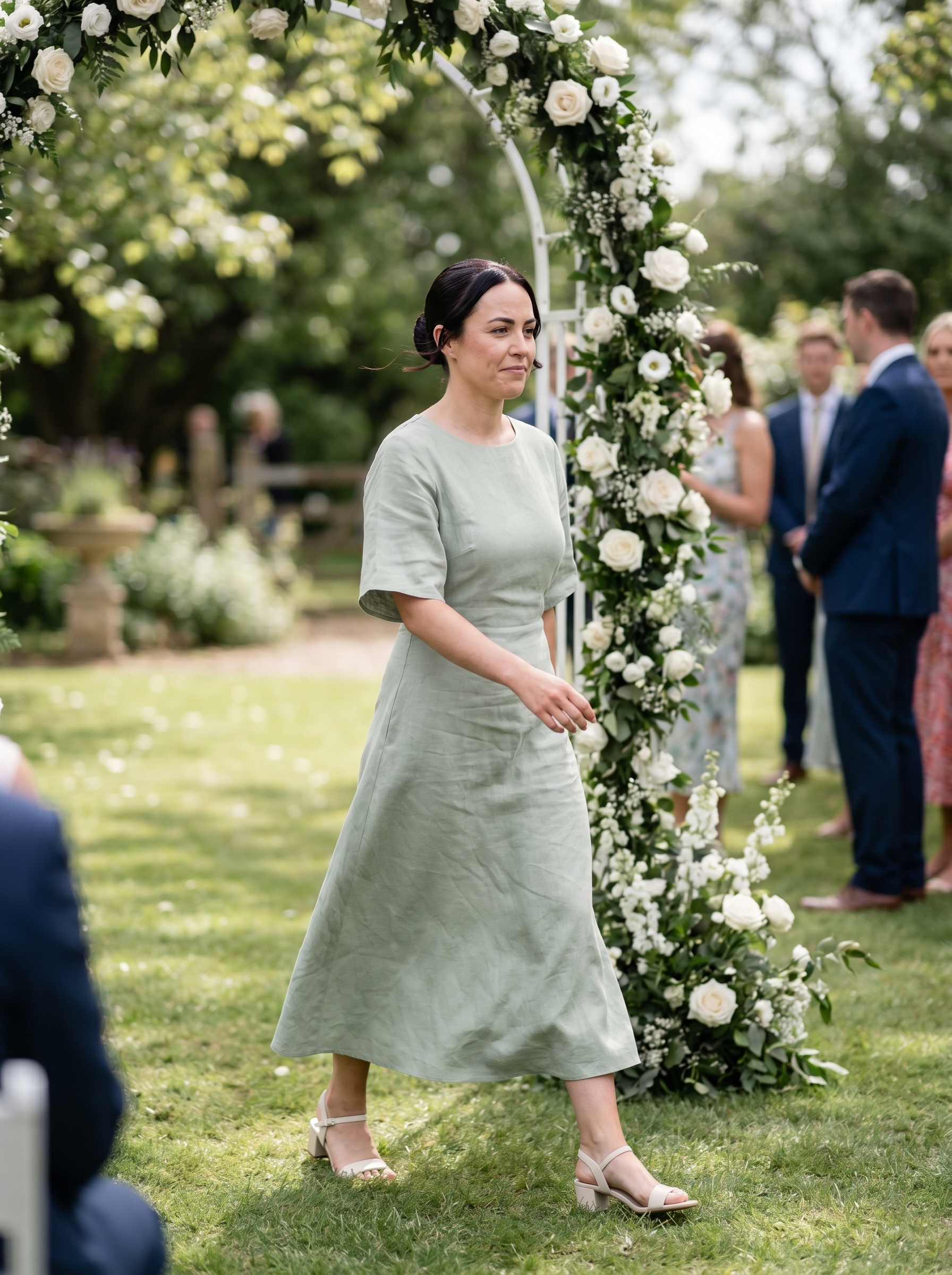 Sophisticated Sculpted Glass Bun, a chic summer wedding guest hairstyle 2026, displaying midnight espresso hair in a sleek, high-shine bun. Ideal for a polished and elegant look.