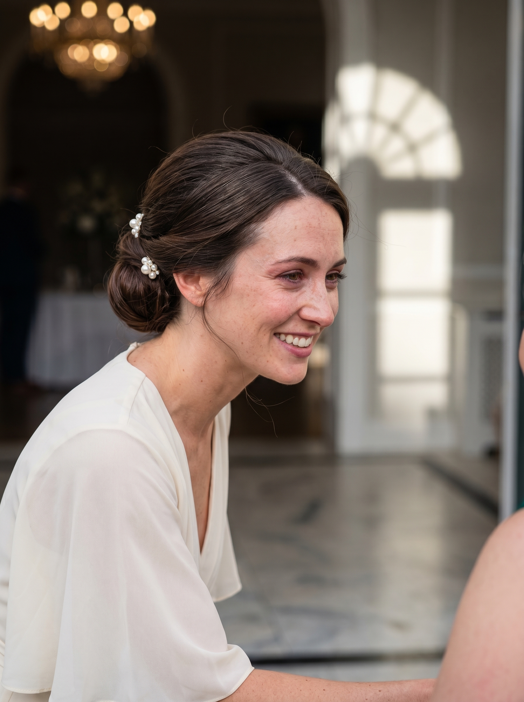 Romantic Modern Regency Pearl Updo, an elegant summer wedding hairstyle option, showcasing a glamorous updo adorned with small ivory pearl hair pins for a sophisticated bridal or guest look.
