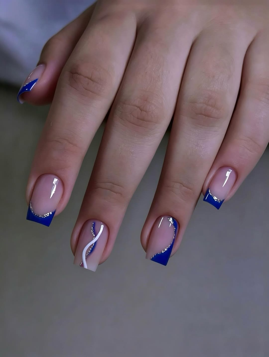 Blue and Silver Confetti Swirl French Tip Nails