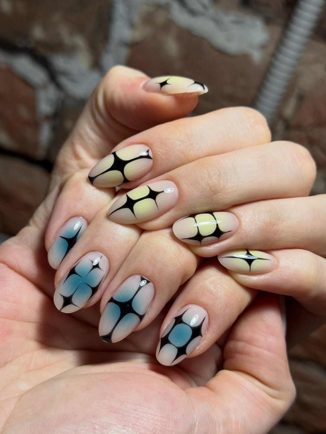 Blue and Yellow Aura Graphic Almond Nails
