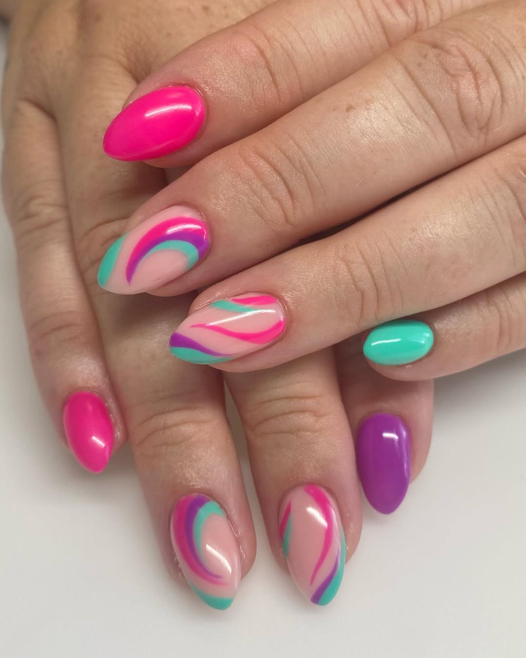 Bright Swirls and Solid Summer Almond Nails