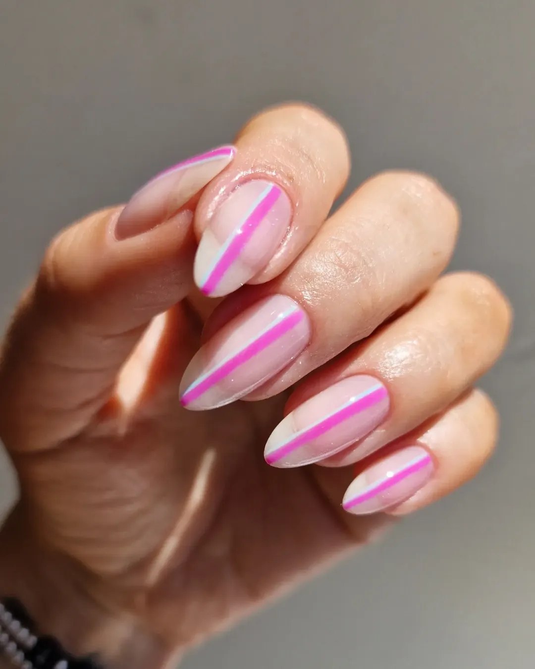 Clear Almond Nails with Neon Pink Stripes