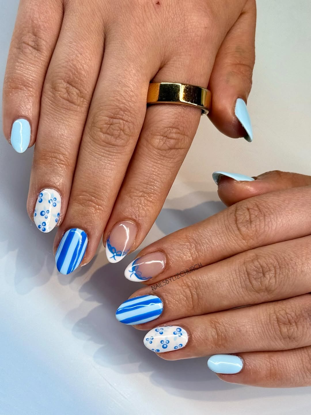 Coastal Blue Swirls and Striped Oval Nails