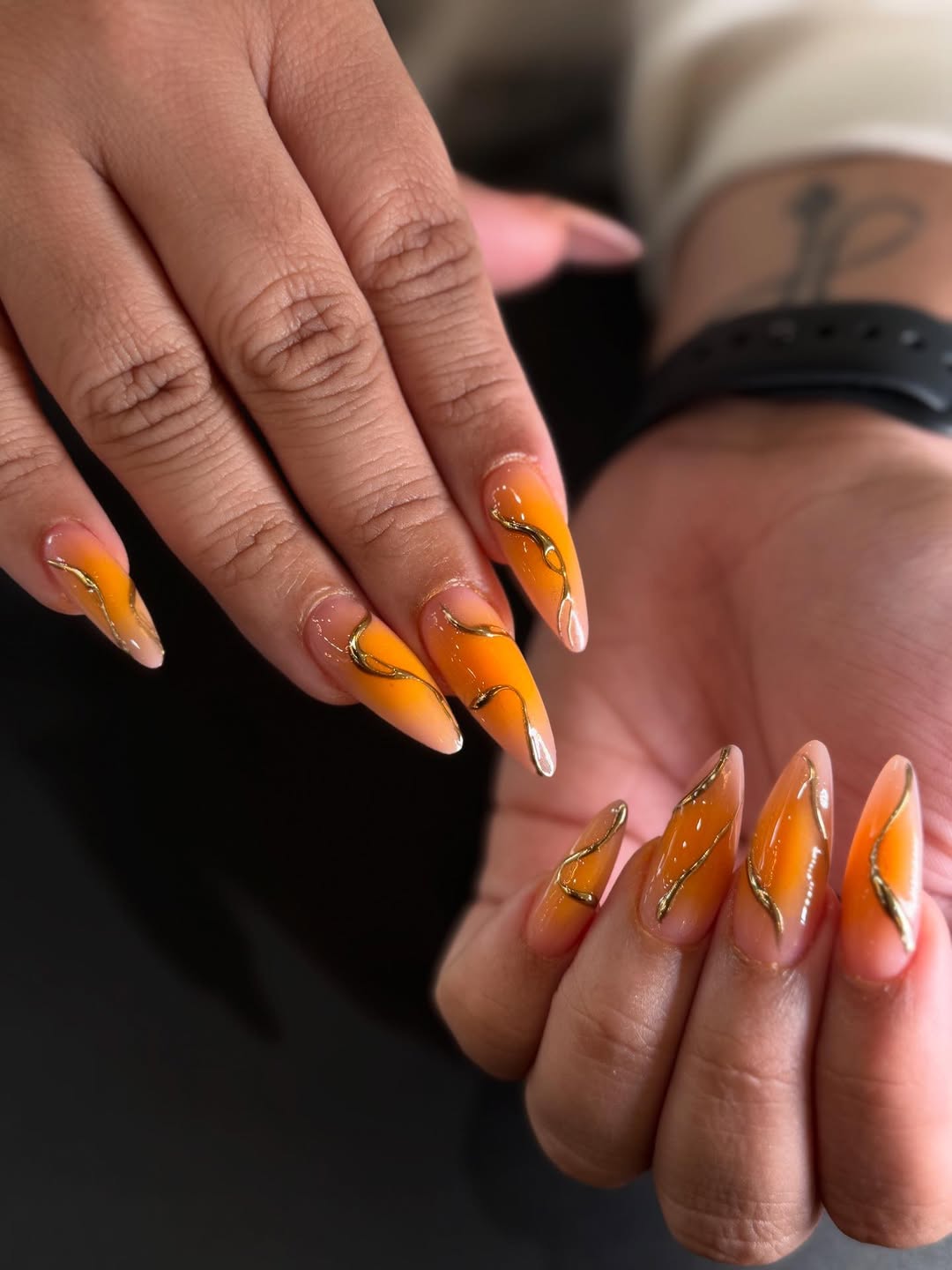 Fiery Orange Ombré Stiletto Nails with Gold Swirls