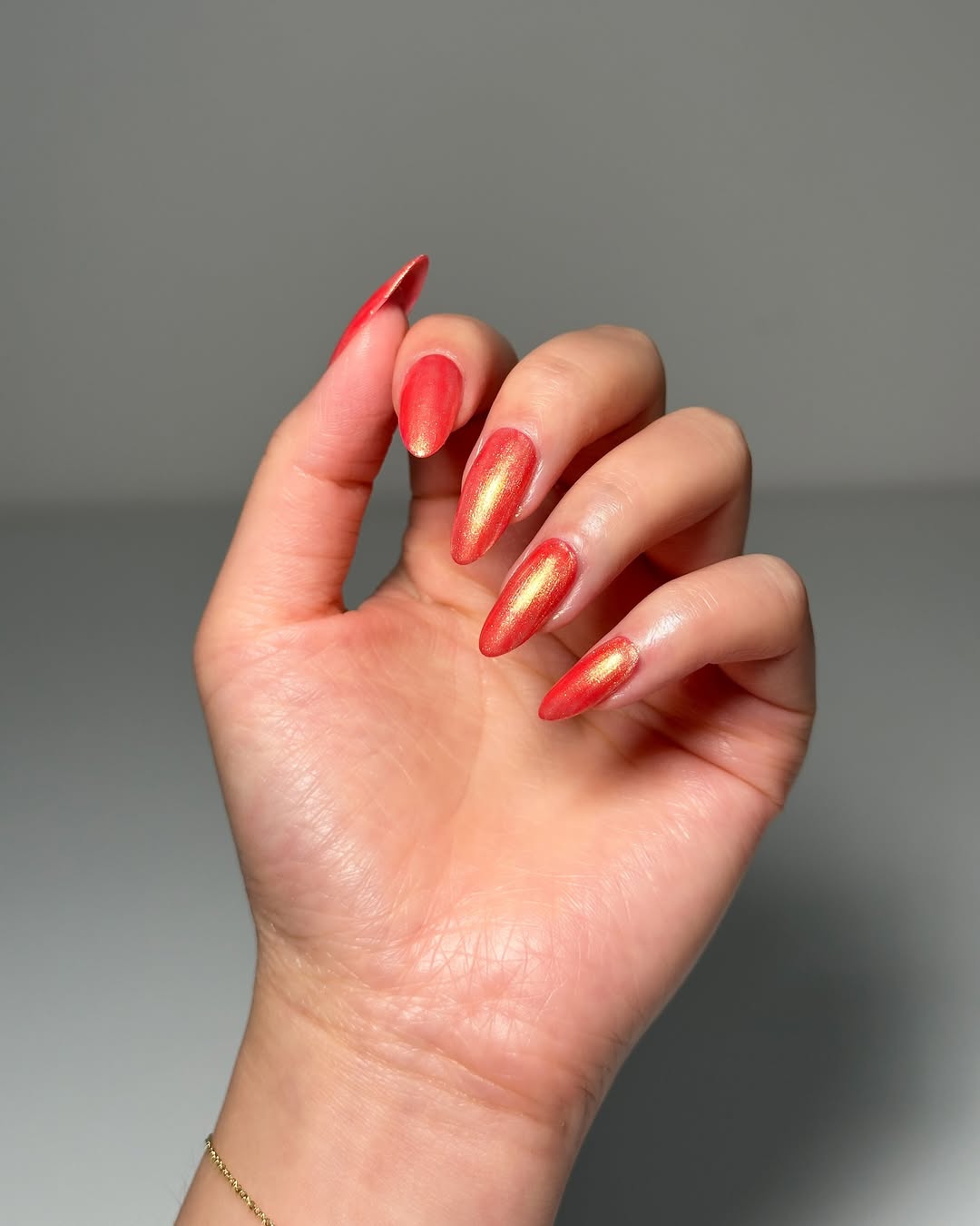 Fiery Red Golden Shimmer Stiletto Nails
