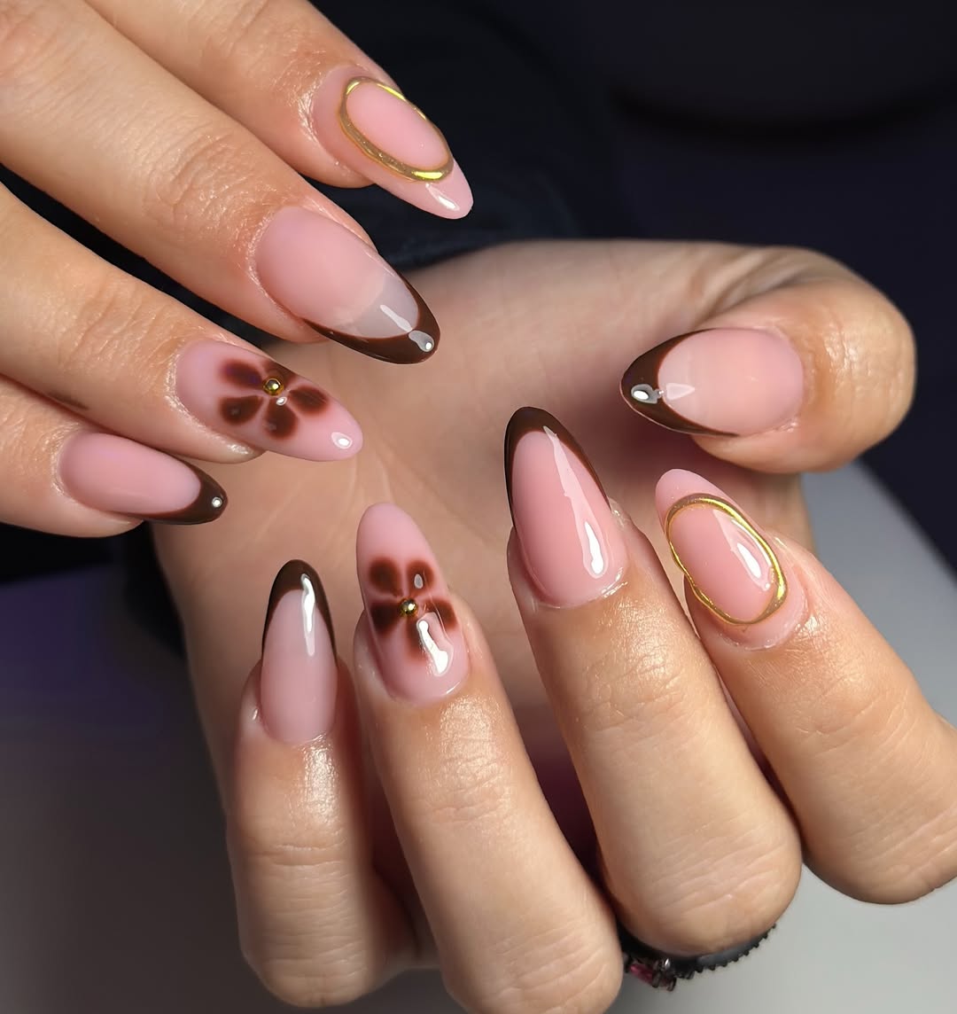 Glossy Chocolate French Tips with Floral and Gold Accents