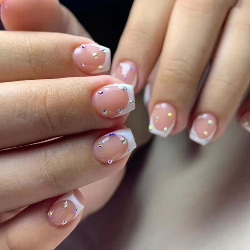 Glossy French Tips with Iridescent Rhinestone Accents