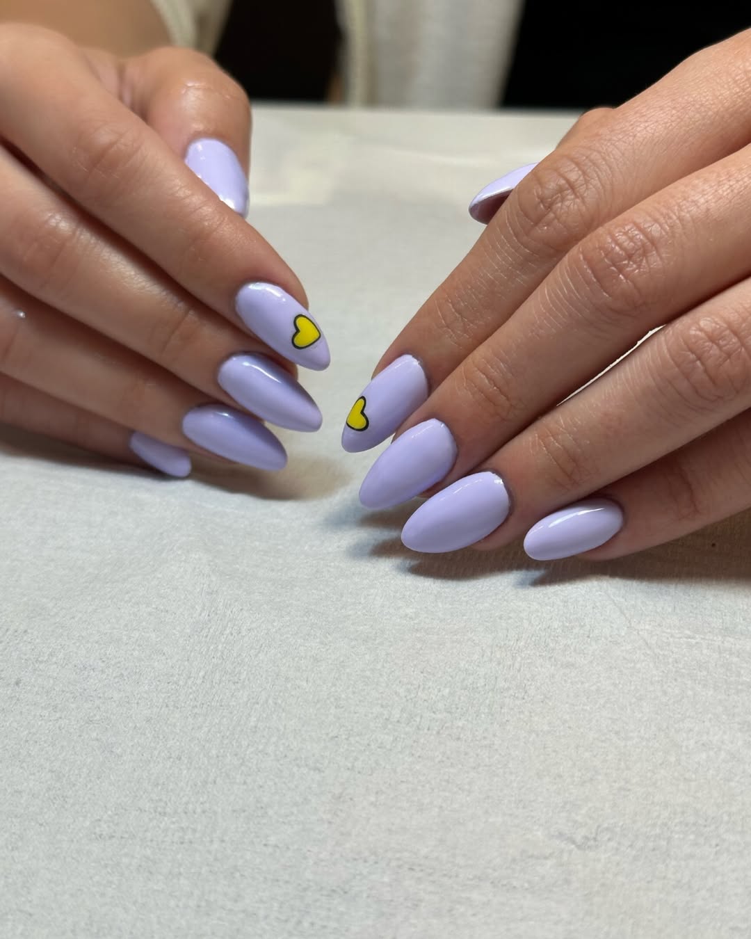 Glossy Lilac Almond Nails With Yellow Heart Detail