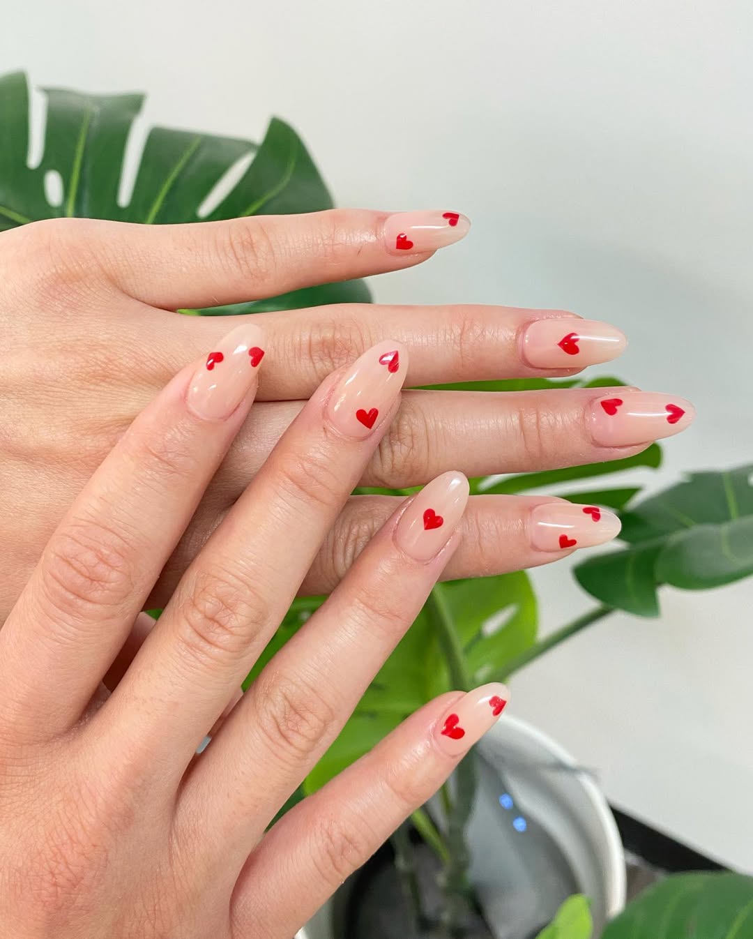 Glossy Sheer Nude Nails With Red Hearts