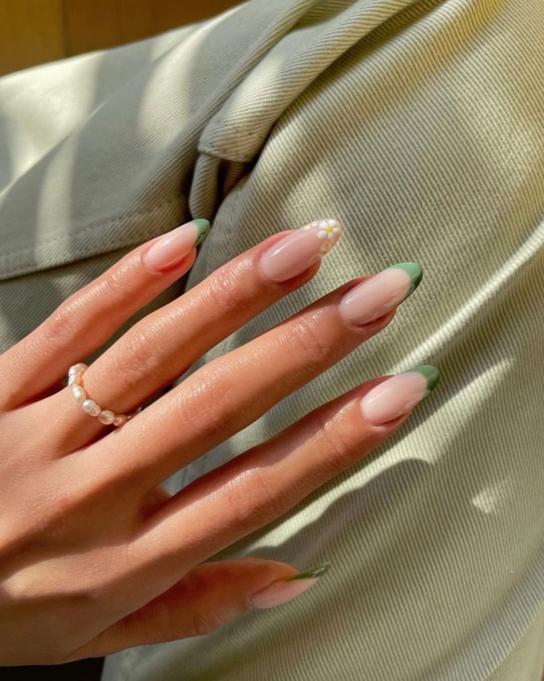 Green French Tips with Daisy Accent Almond Nails