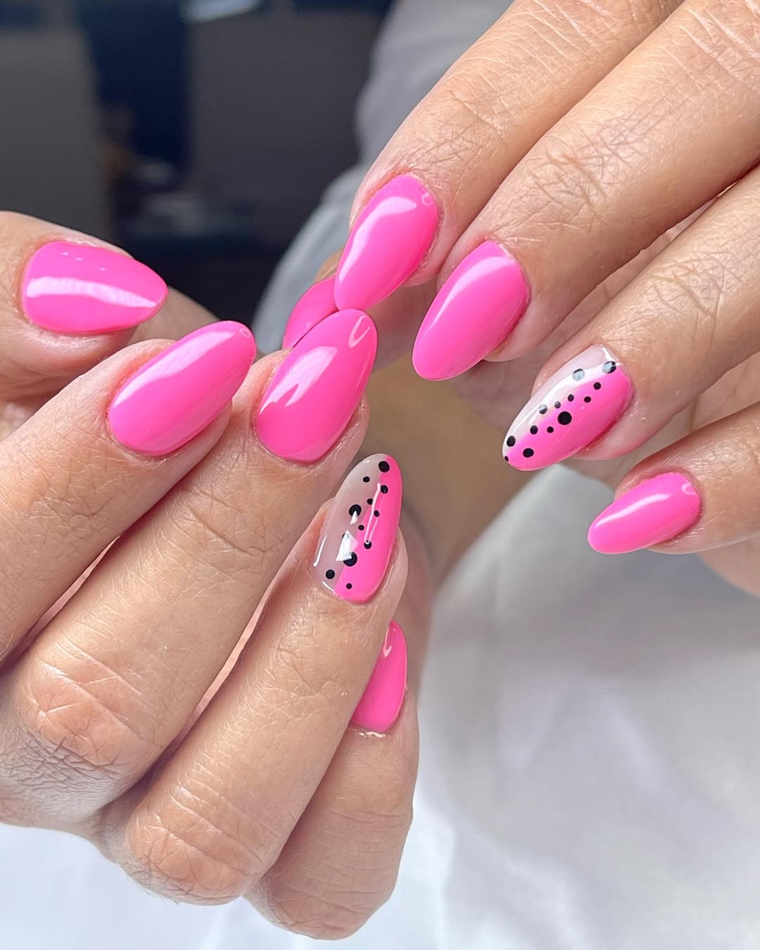 Hot Pink Almond Nails With Playful Dot Art