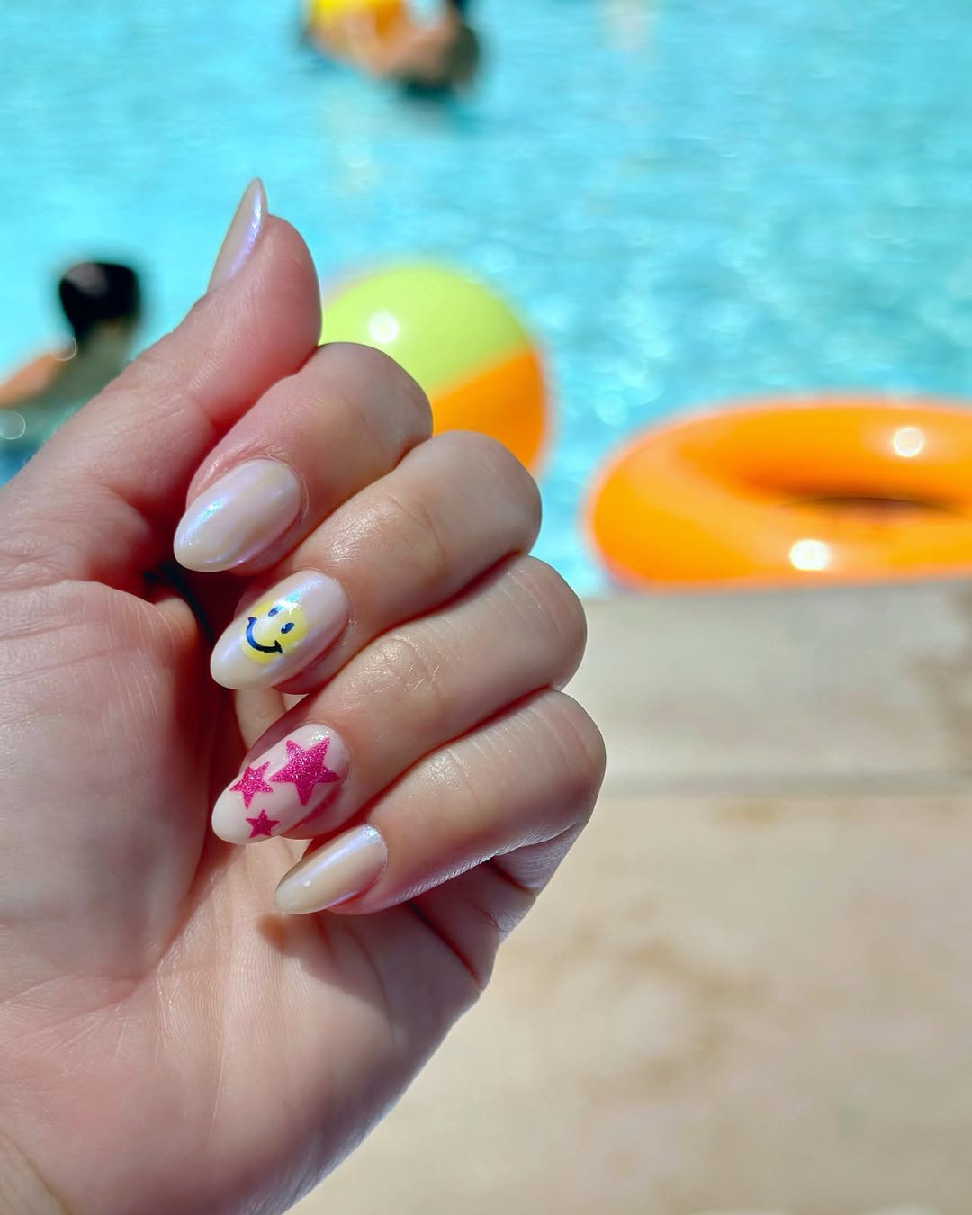Iridescent Nude Almond Nails With Playful Accents