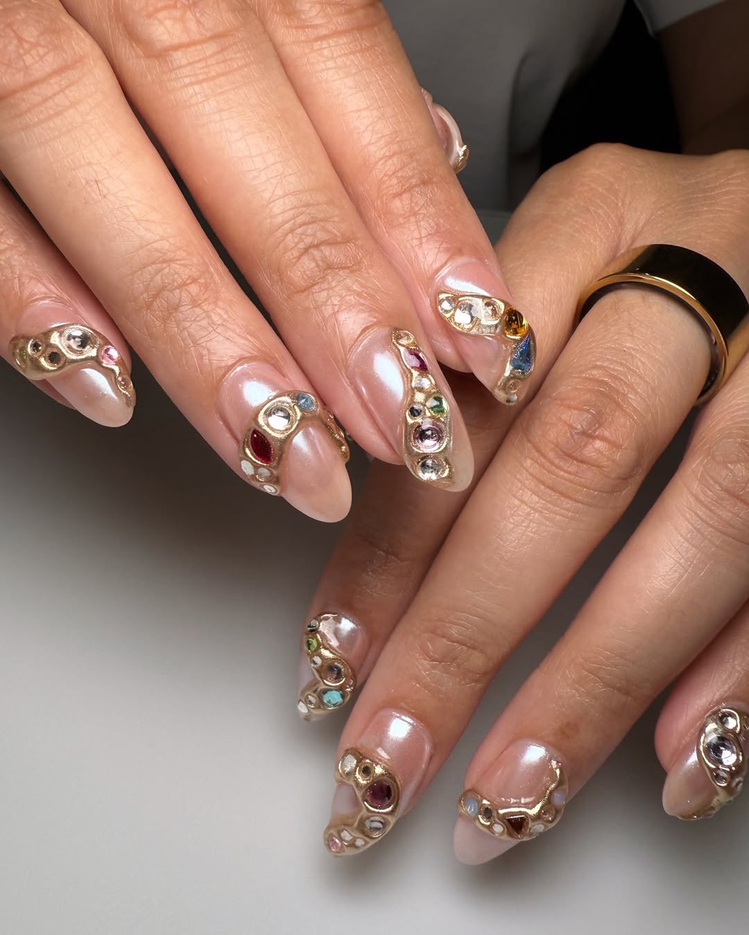 Luxurious Gemstone And Gold Encased Almond Nails