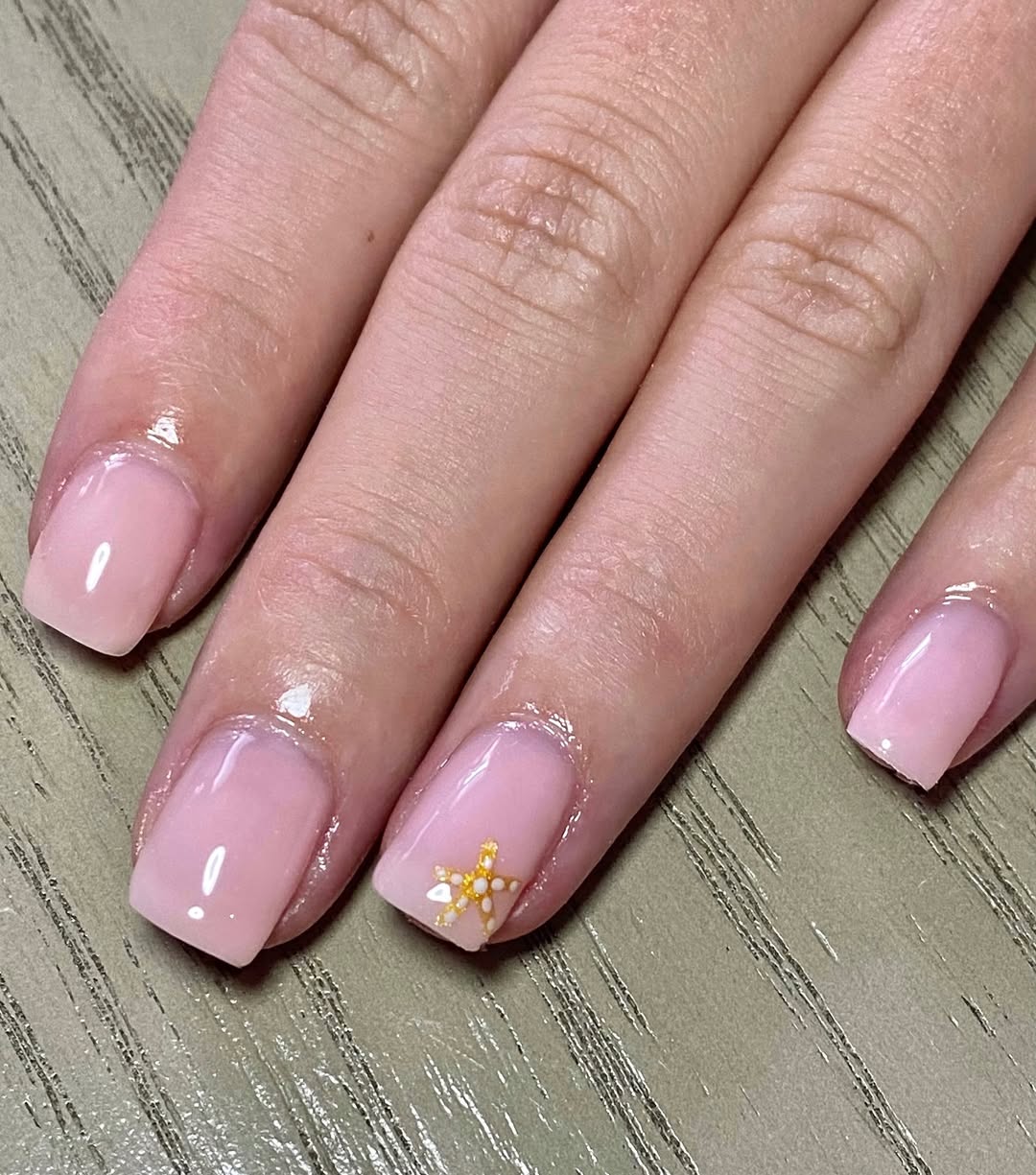 Milky Pink Squoval Nails With Starfish Accent