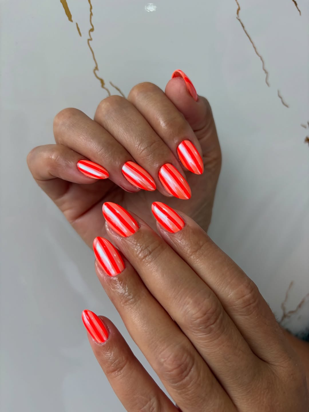 Neon Orange and White Striped Almond Nails