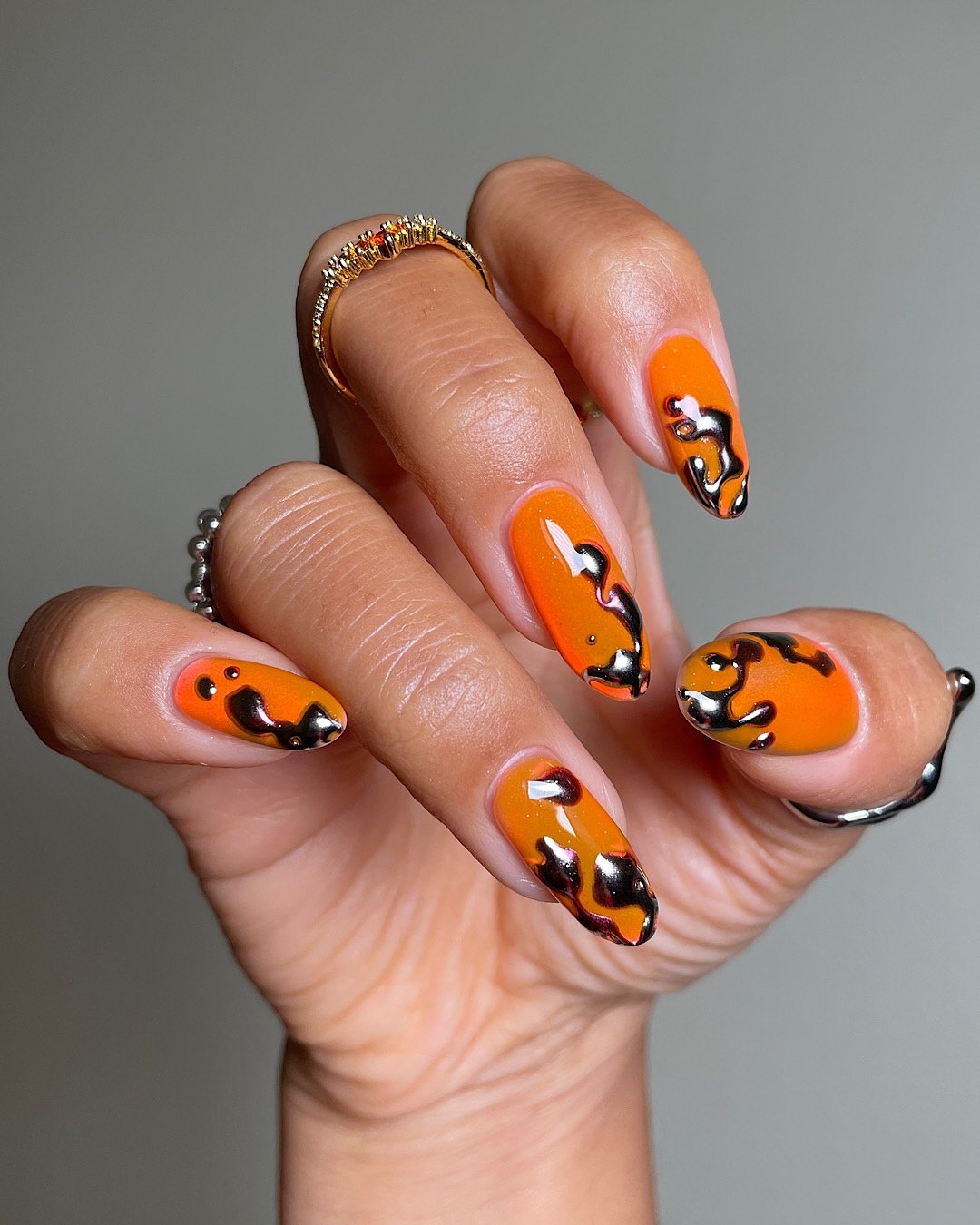 Neon Orange Black Chrome Drip Long Almond Nails