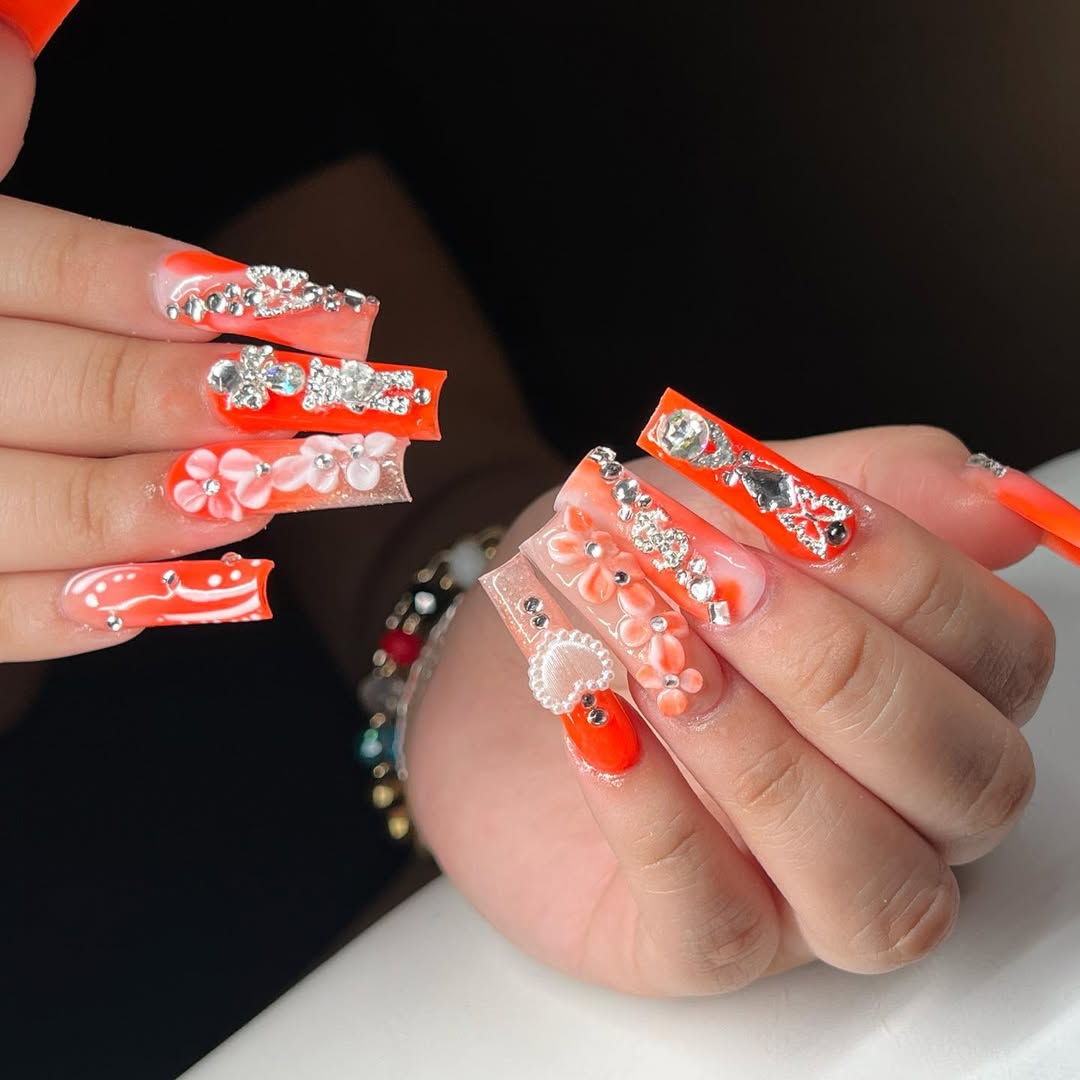 Neon Orange Jewel and Floral Coffin Nails