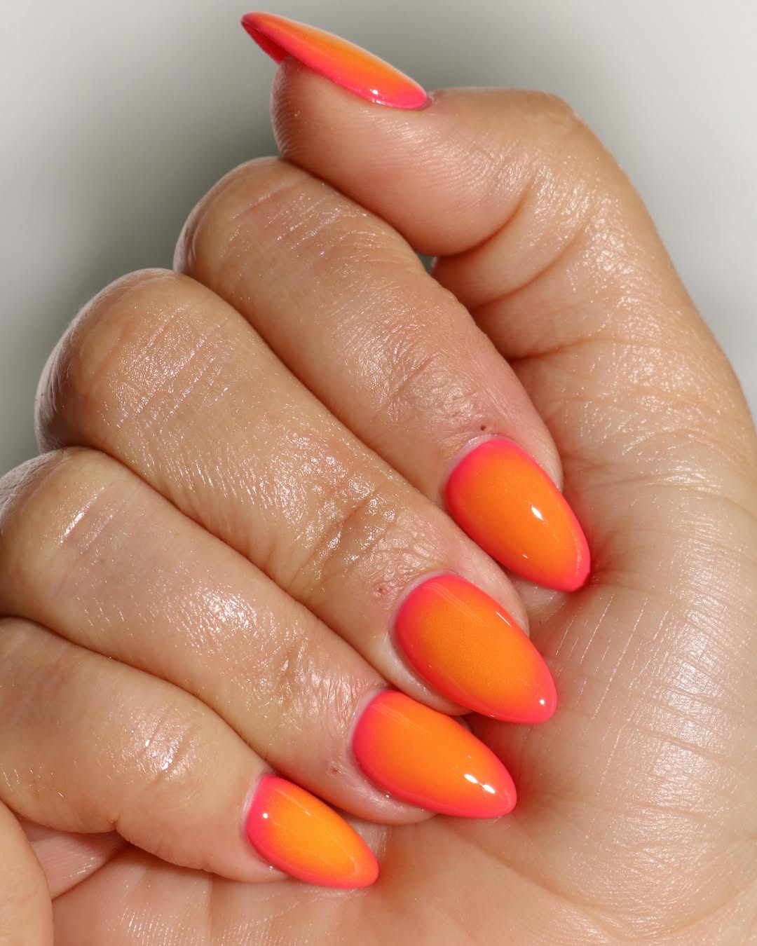 Neon Pink and Orange Glossy Ombré Almond Nails