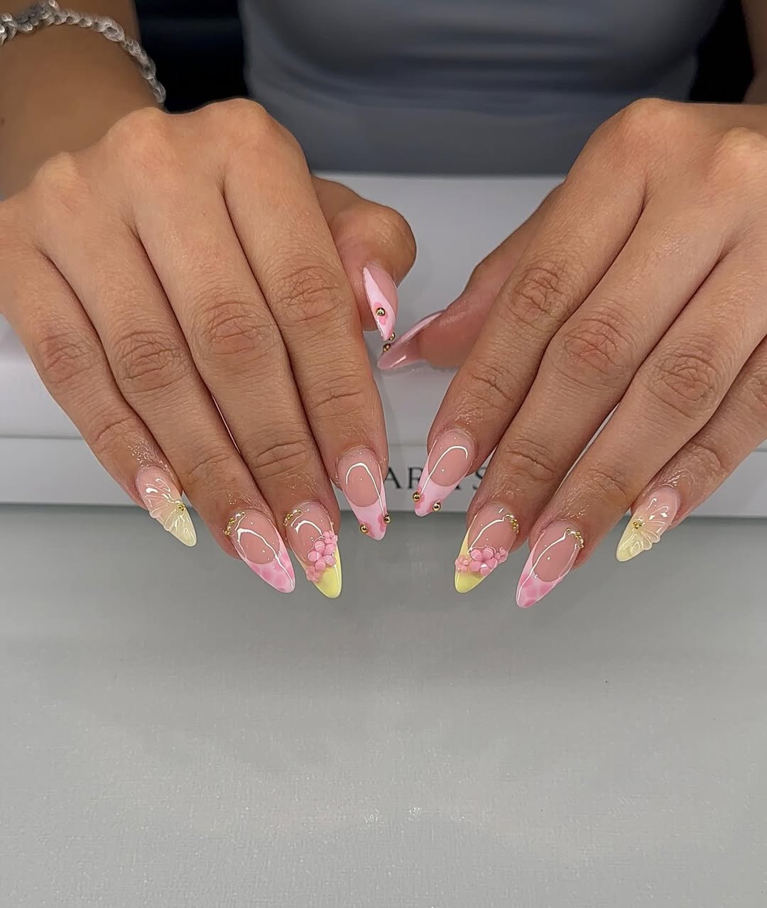 Pastel Pink Yellow Swirl Almond Nails