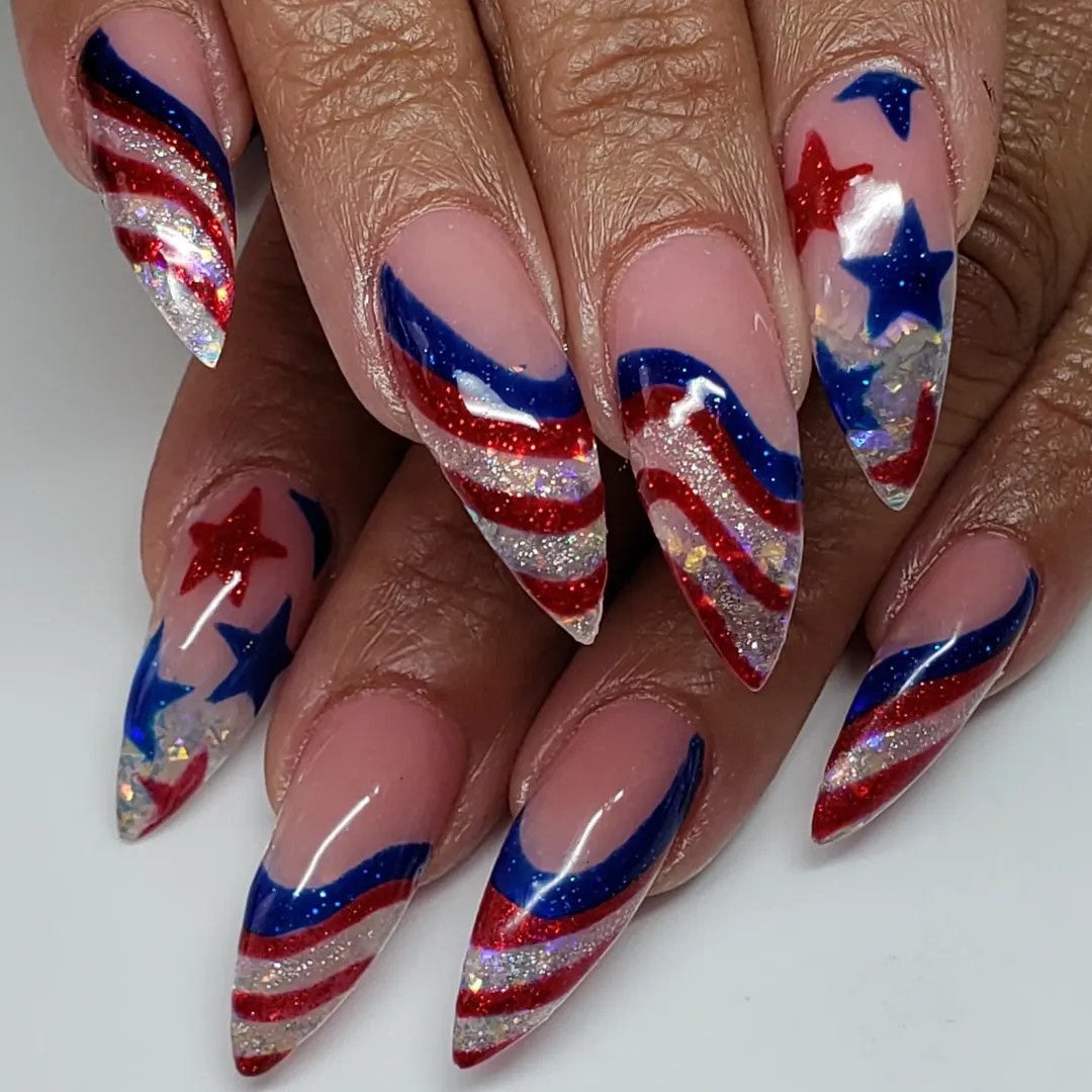 25 Patriotic Nail Ideas for 2026 You’ll Love 17 Patriotic Glitter Stripes And Stars Stiletto Nails