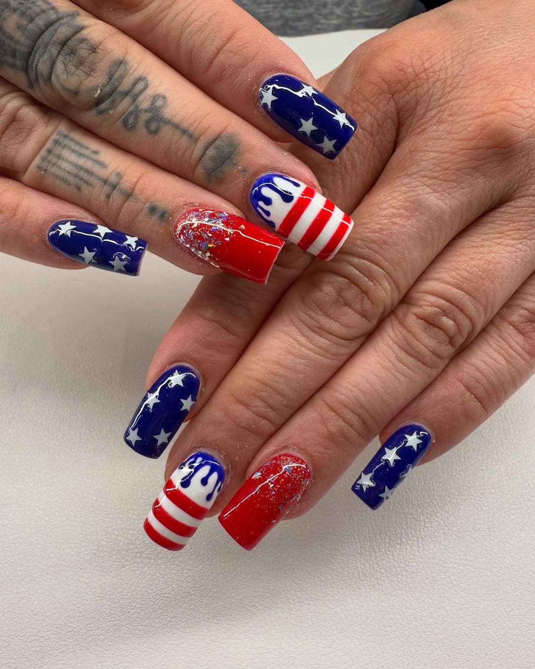 25 Patriotic Nail Ideas for 2026 You’ll Love 27 Patriotic Red White Blue Square Glitter Nails