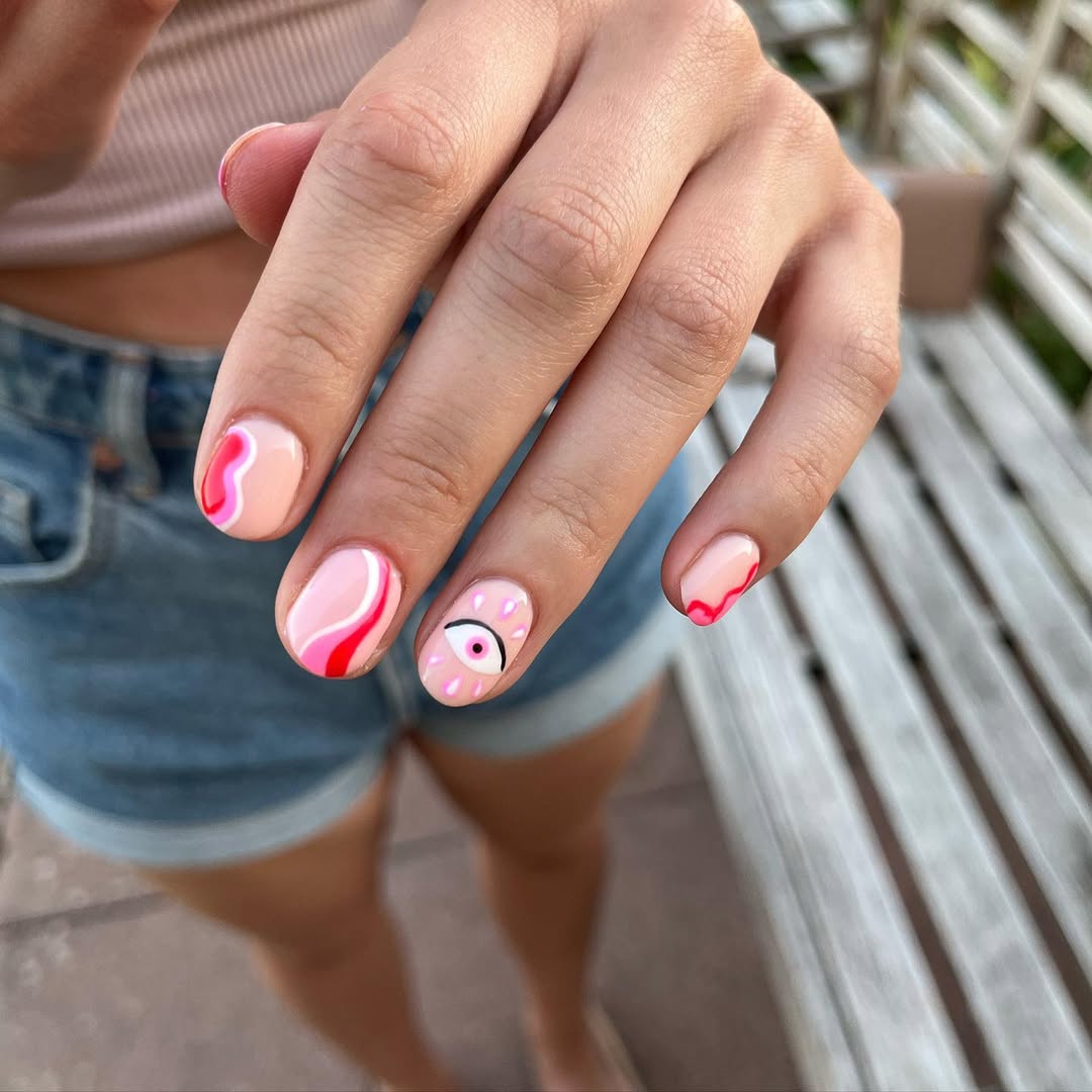 Playful Gaze Eye Design Pink Swirl Nails
