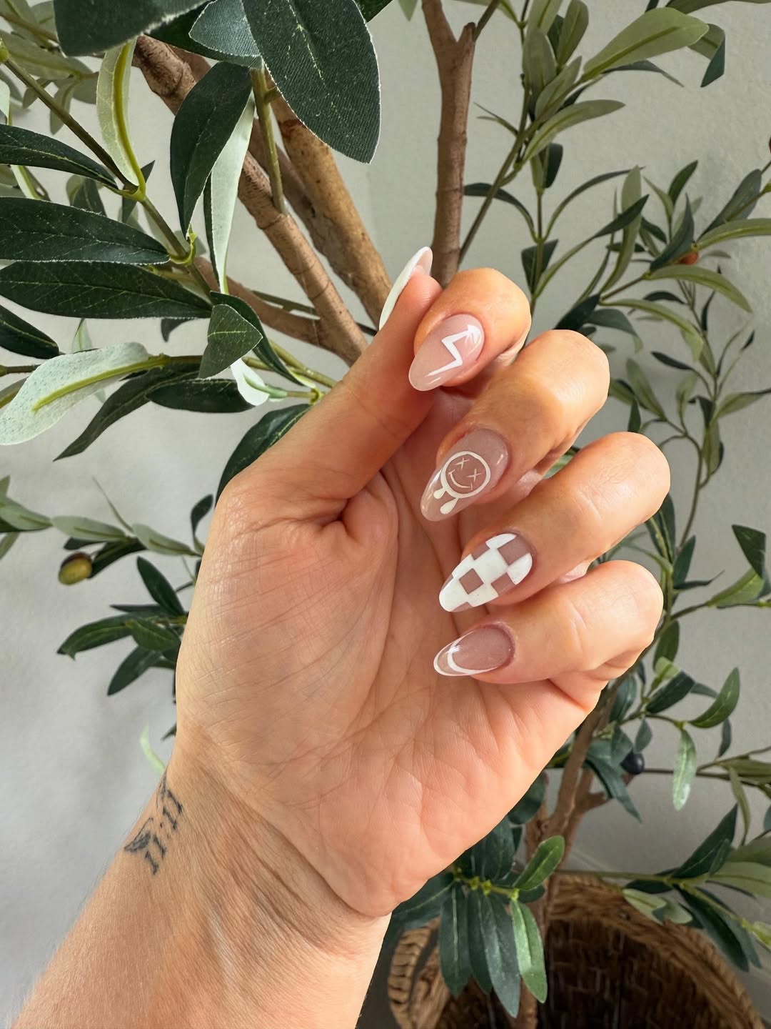 Playful Glimmer Nude White Detailed Almond Nails