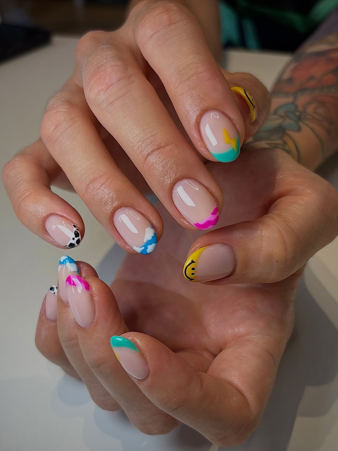 Playful Mismatched Skittle French Tip Oval Nails