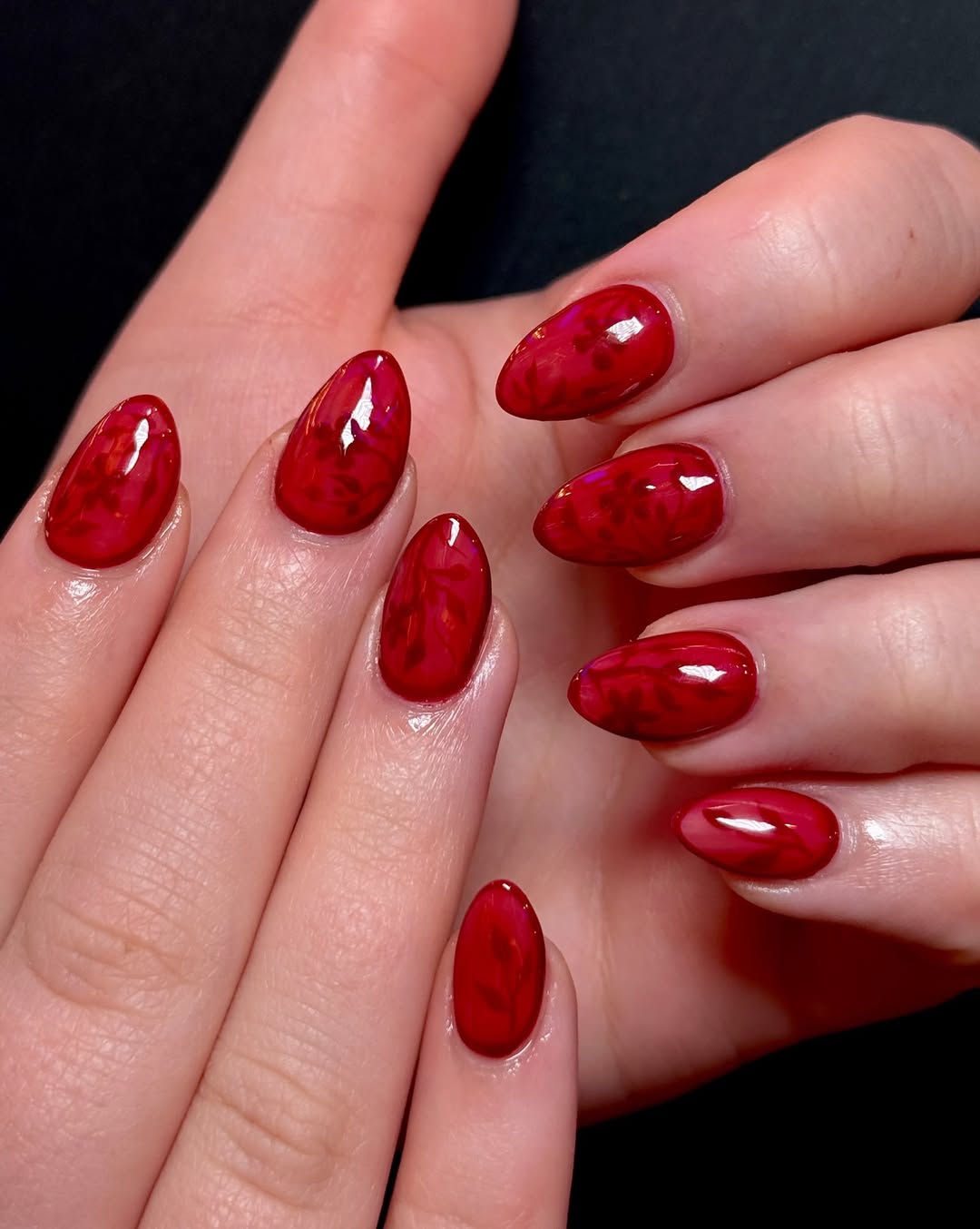 Ruby Red Marble Glossy Almond Nails