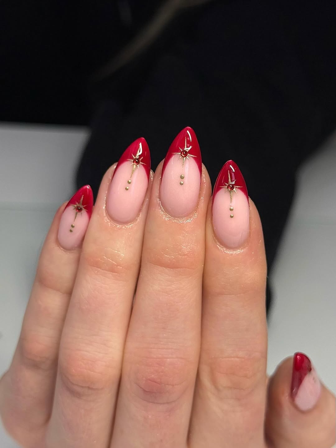 Ruby Red Stiletto French Tips with Gemstone Starbursts