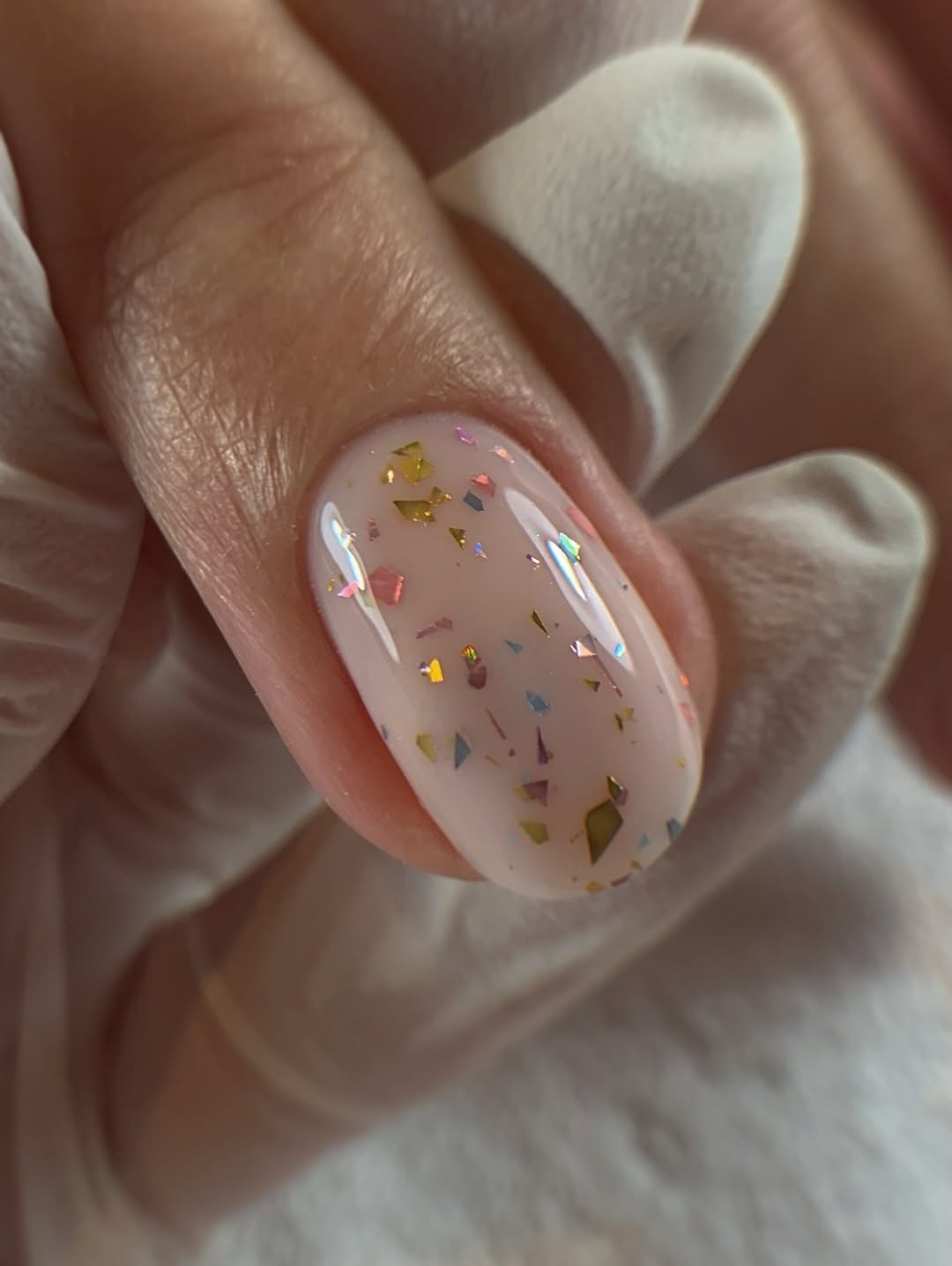 Shimmering Nude Confetti Oval Dip Nails