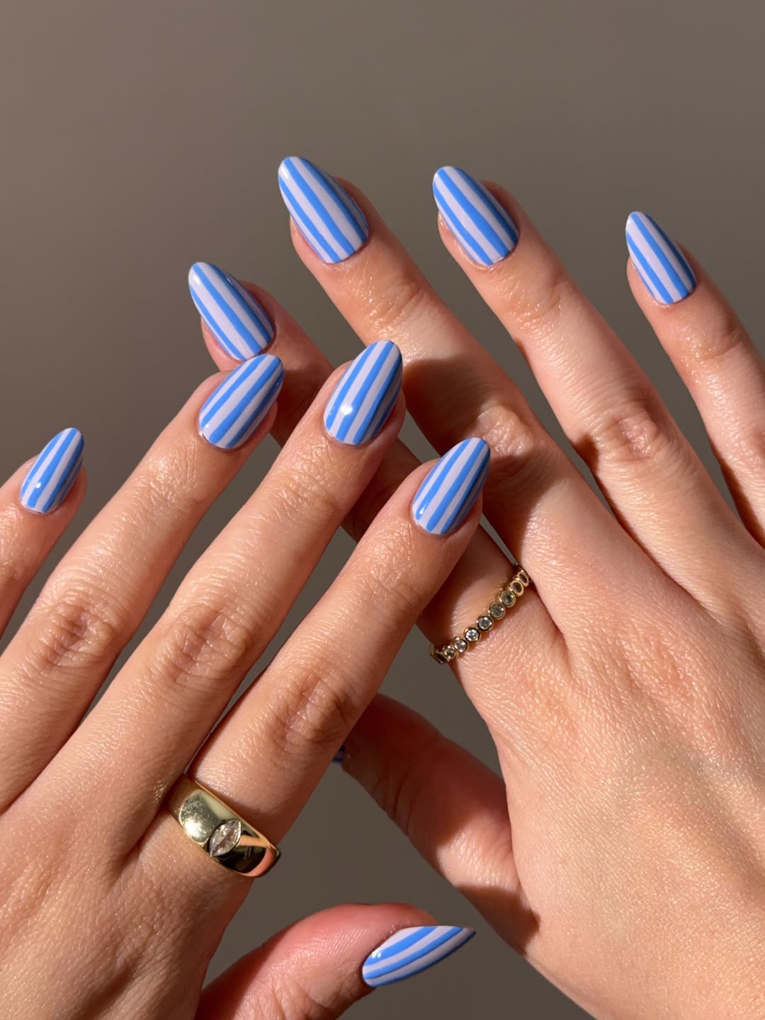 Sky Blue and White Striped Almond Nails