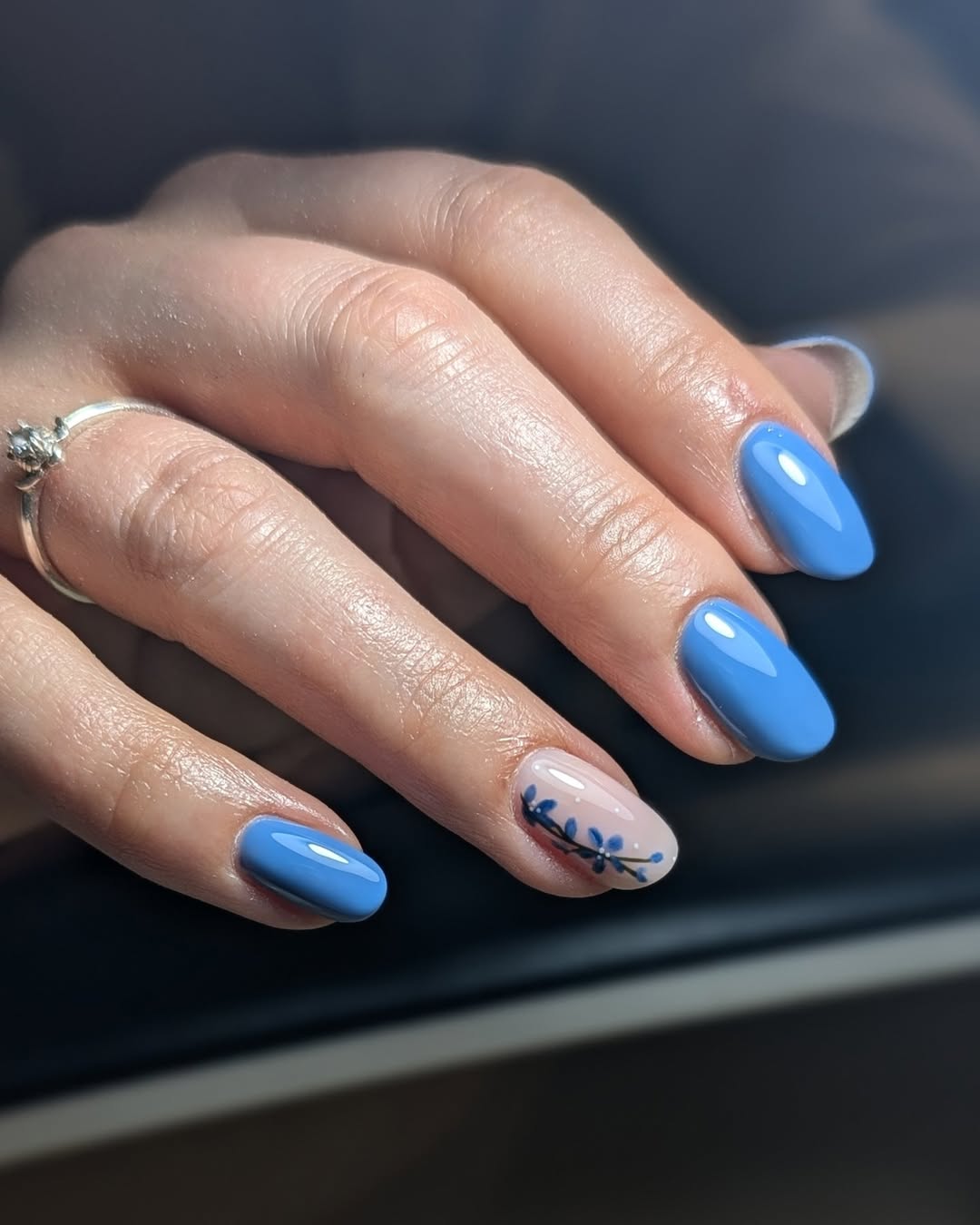 Sky Blue Glossy Oval Nails with Floral Accent