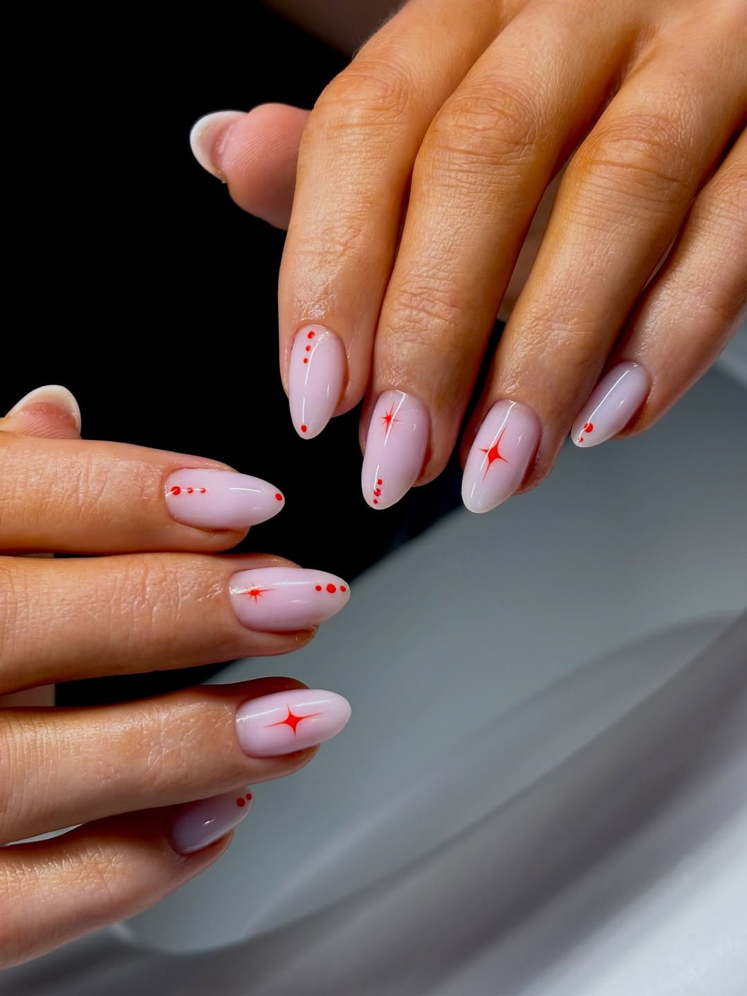 Soft Pink Starburst & Dotted Almond Nails