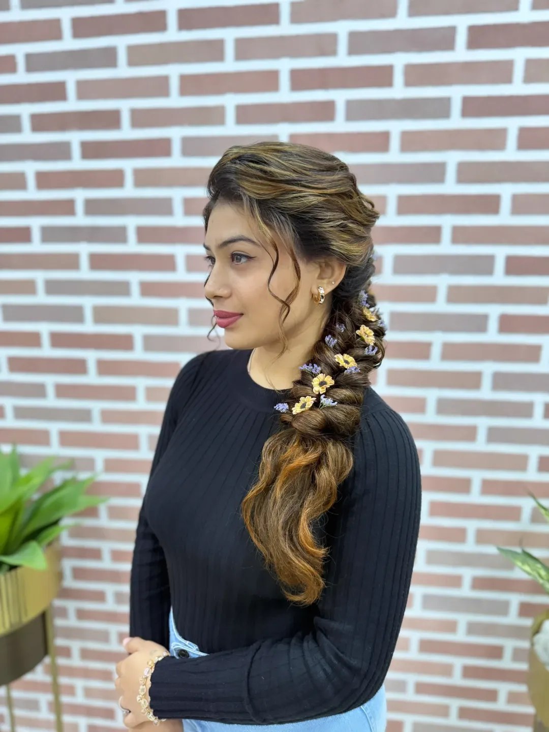 Close-up of a woman with sophisticated summer braid hairstyles 2026, featuring sleek cornrows styled into a high ponytail ideal for warm weather.