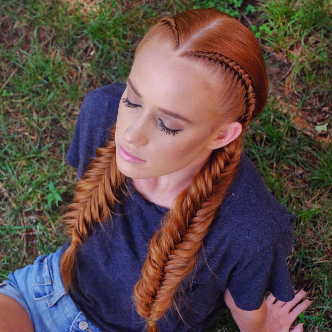 Close-up of a woman with a chic, messy fishtail summer braid hairstyle 2026, featuring sun-kissed blonde hair and delicate face-framing strands. Perfect for a casual day out.