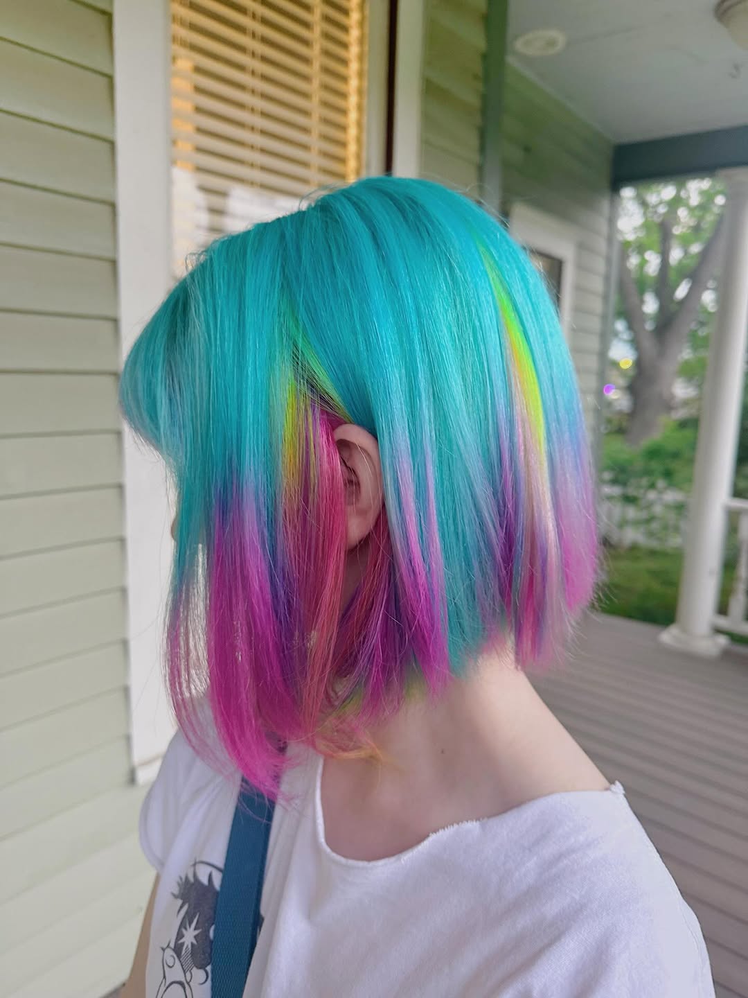 Woman with long, wavy blonde hair with sun-kissed highlights, styled casually for a summer day. Exemplifies 'summer hair trends 2026' with natural texture and soft waves, perfect for beach or casual outings.